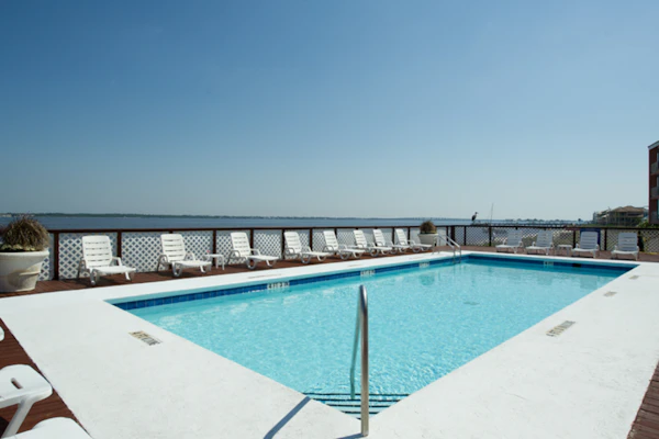 Inviting condo with bay & ocean views, & pool - steps to the beach