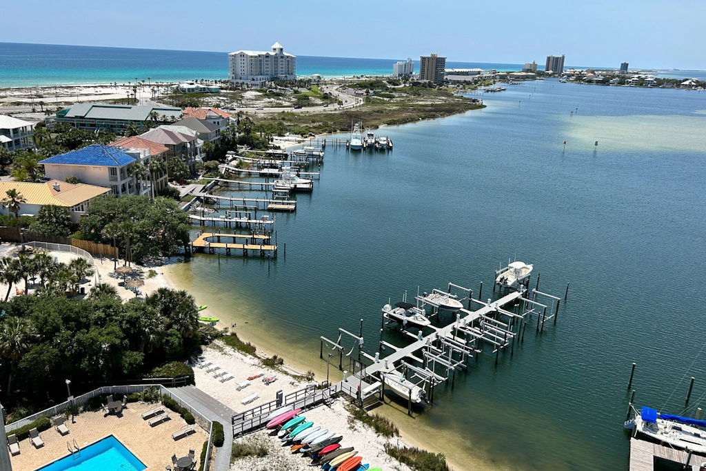 Second-story waterfront condo with pool view, W/D, AC - perfect location