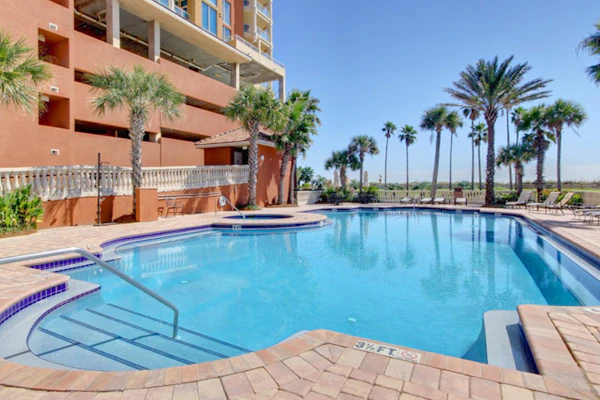 Gulf-view condo with pool, hot tub, beach access, tennis, balcony, AC, & W/D