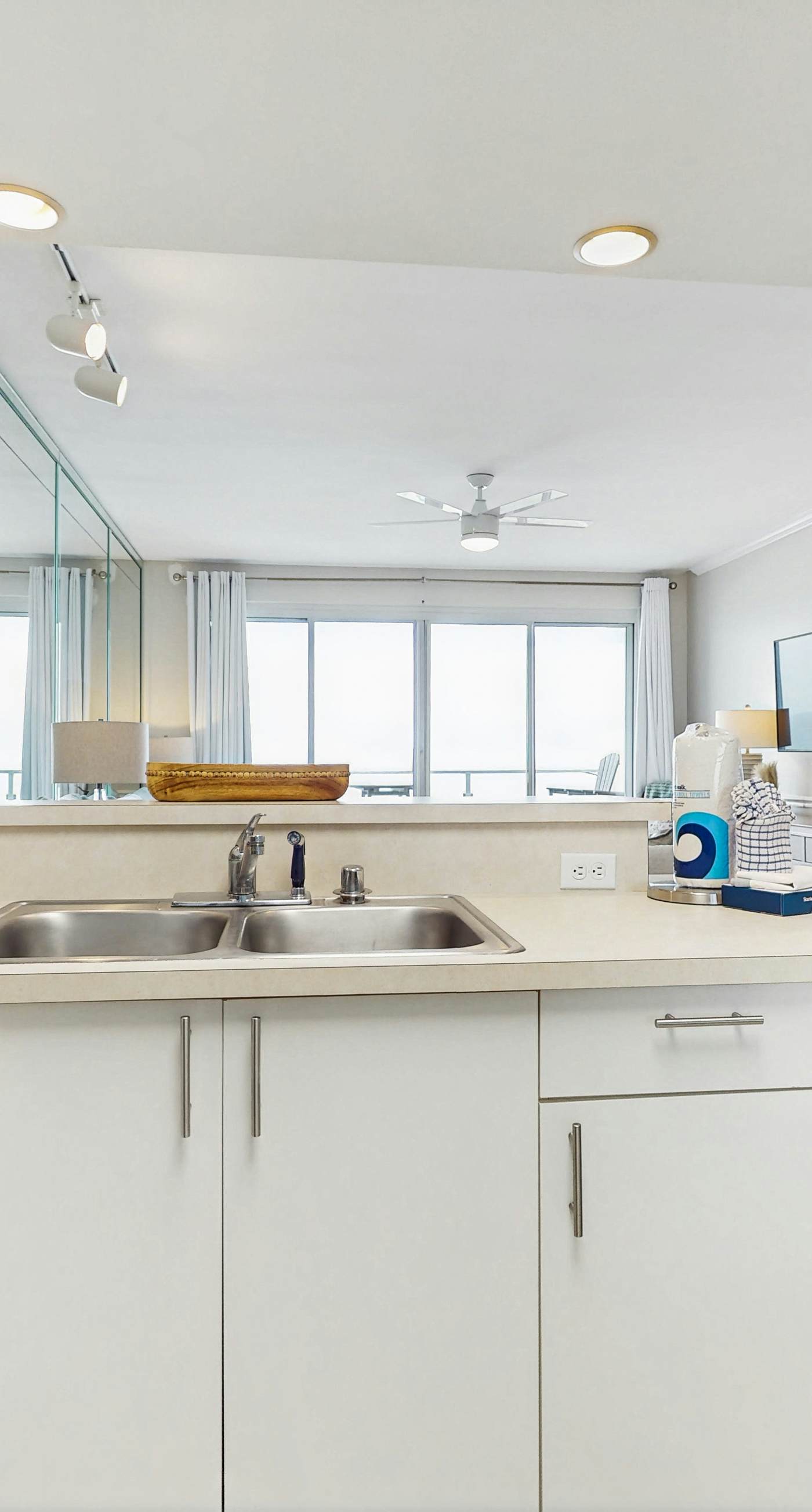 Stunning waterfront home with convenient beach access, pool & gym