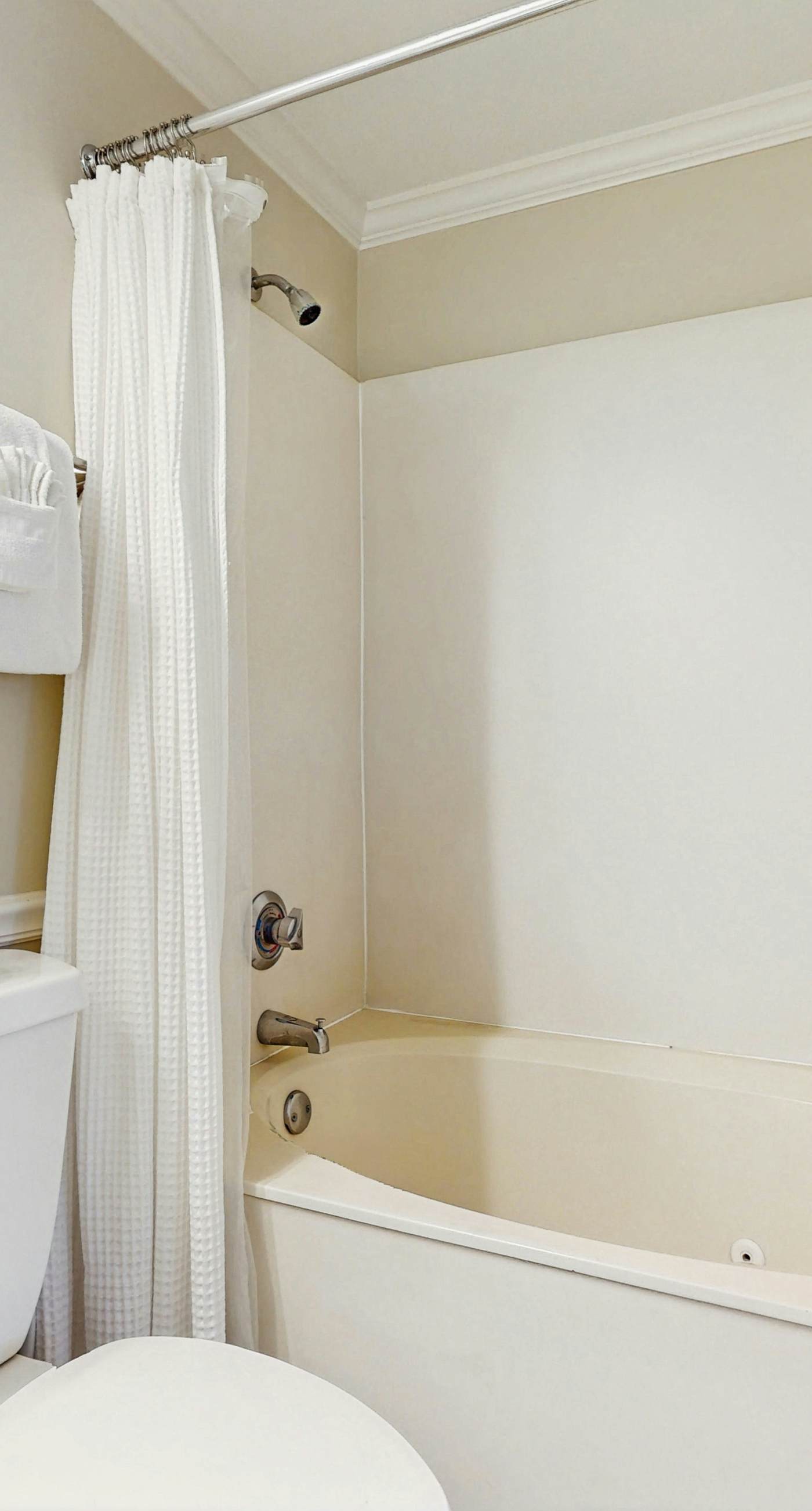 Stunning waterfront home with convenient beach access, pool & gym