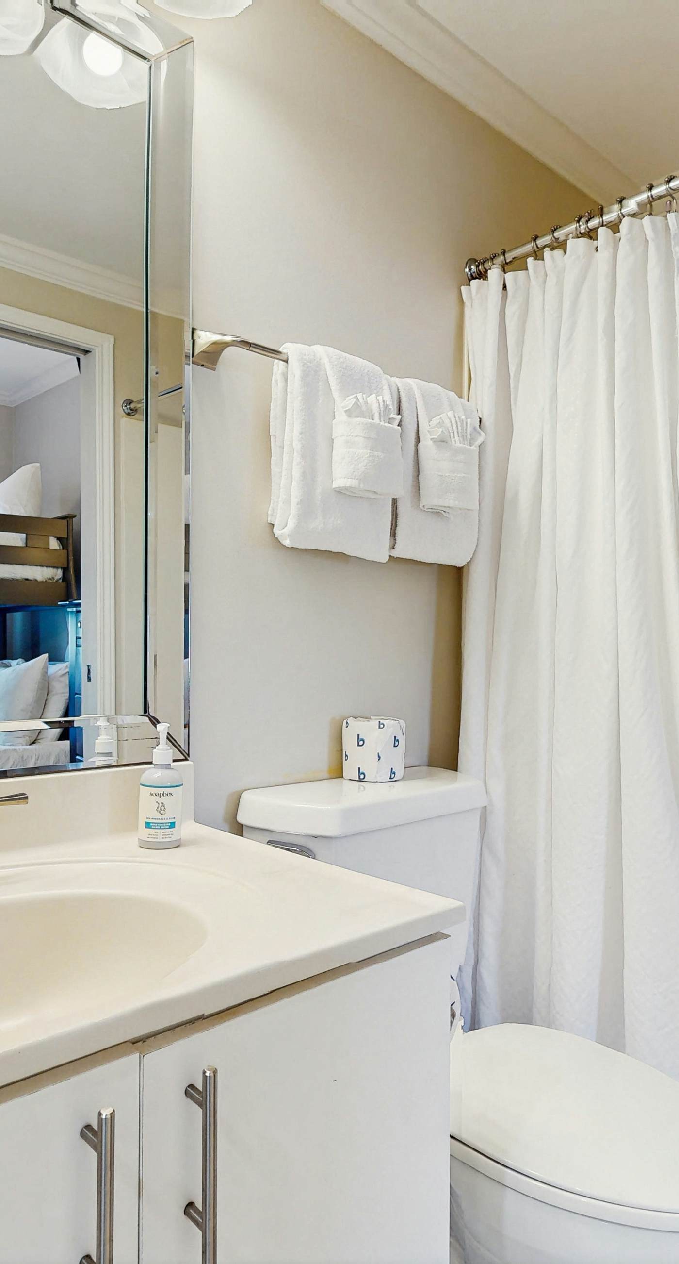 Stunning waterfront home with convenient beach access, pool & gym