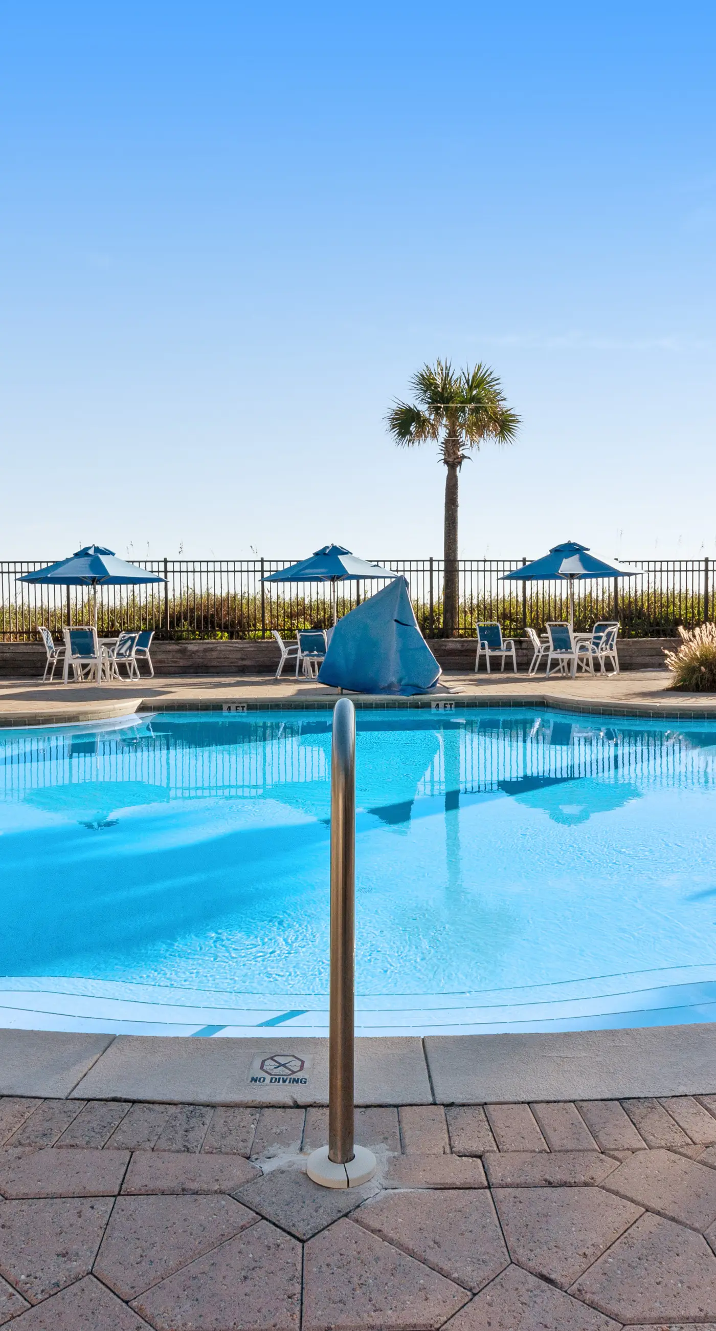 Inviting & sleek condo w/private balcony, shared pool, grill & fitness center