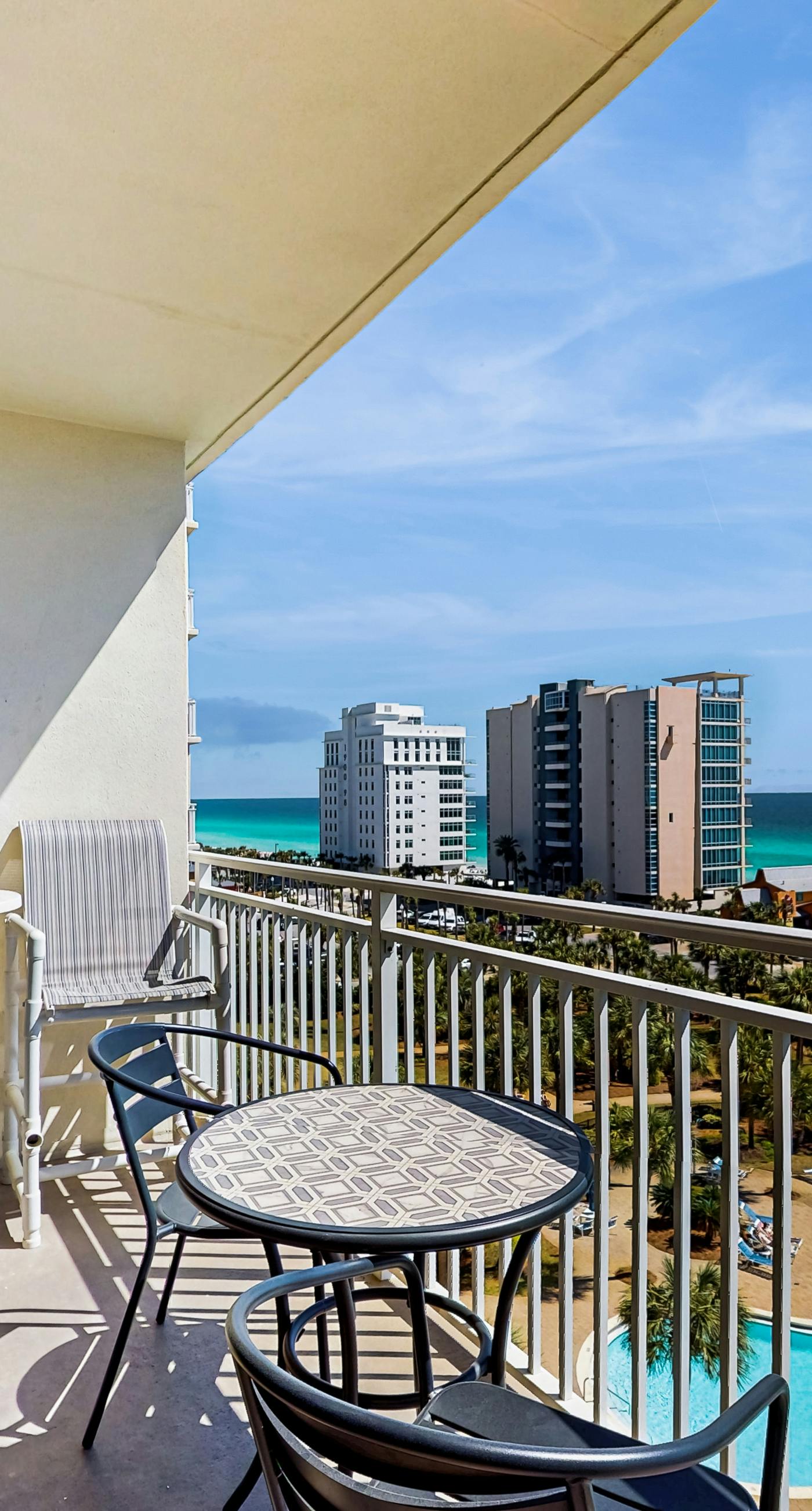 Elegant condo w/ water views, private balcony, shared fitness center and grills