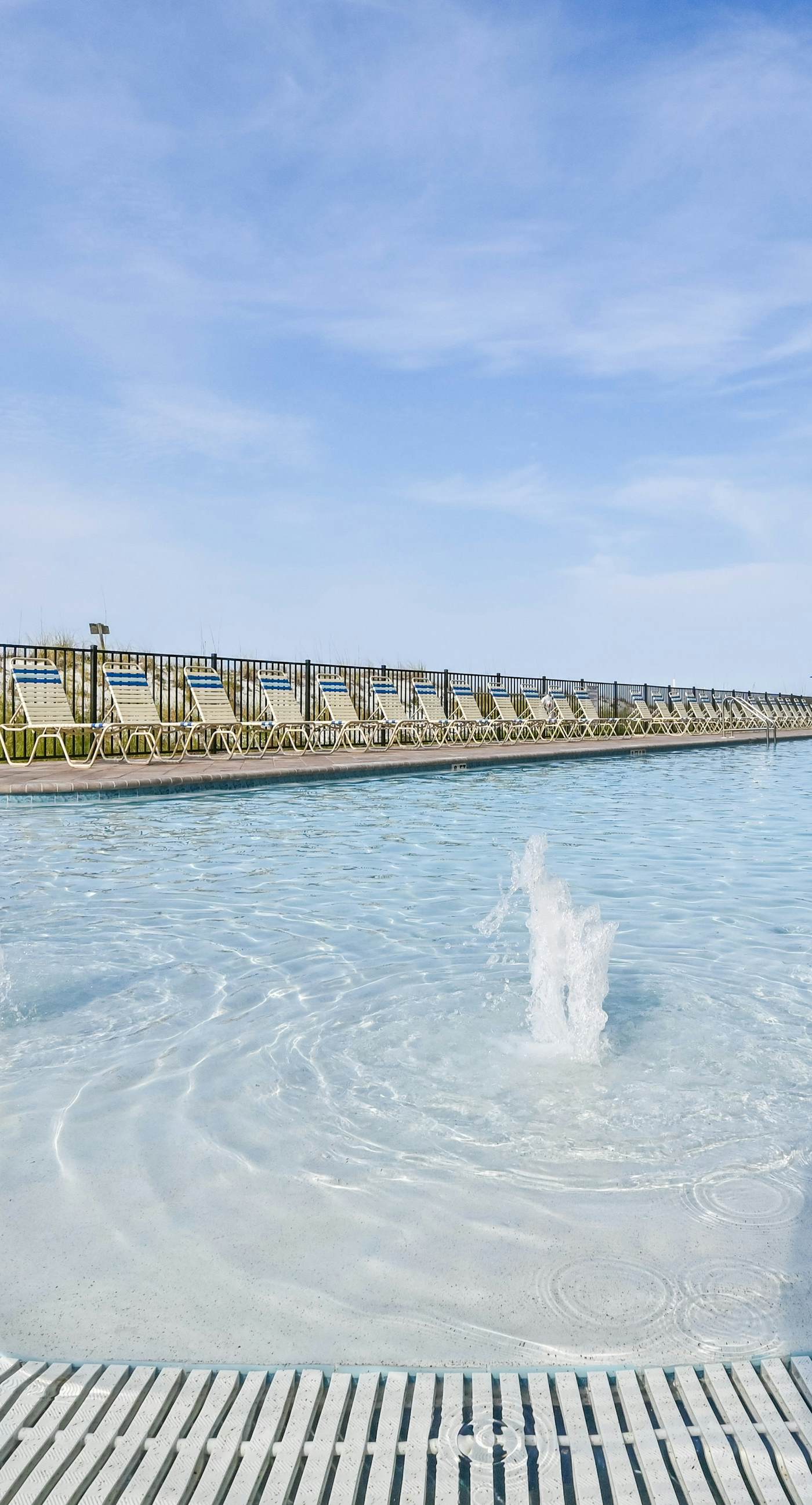 5th-floor condo with patio, pool & ocean views