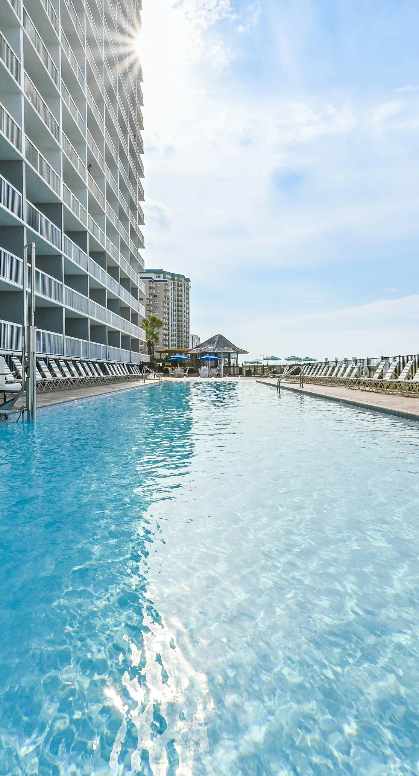 5th-floor condo with patio, pool & ocean views