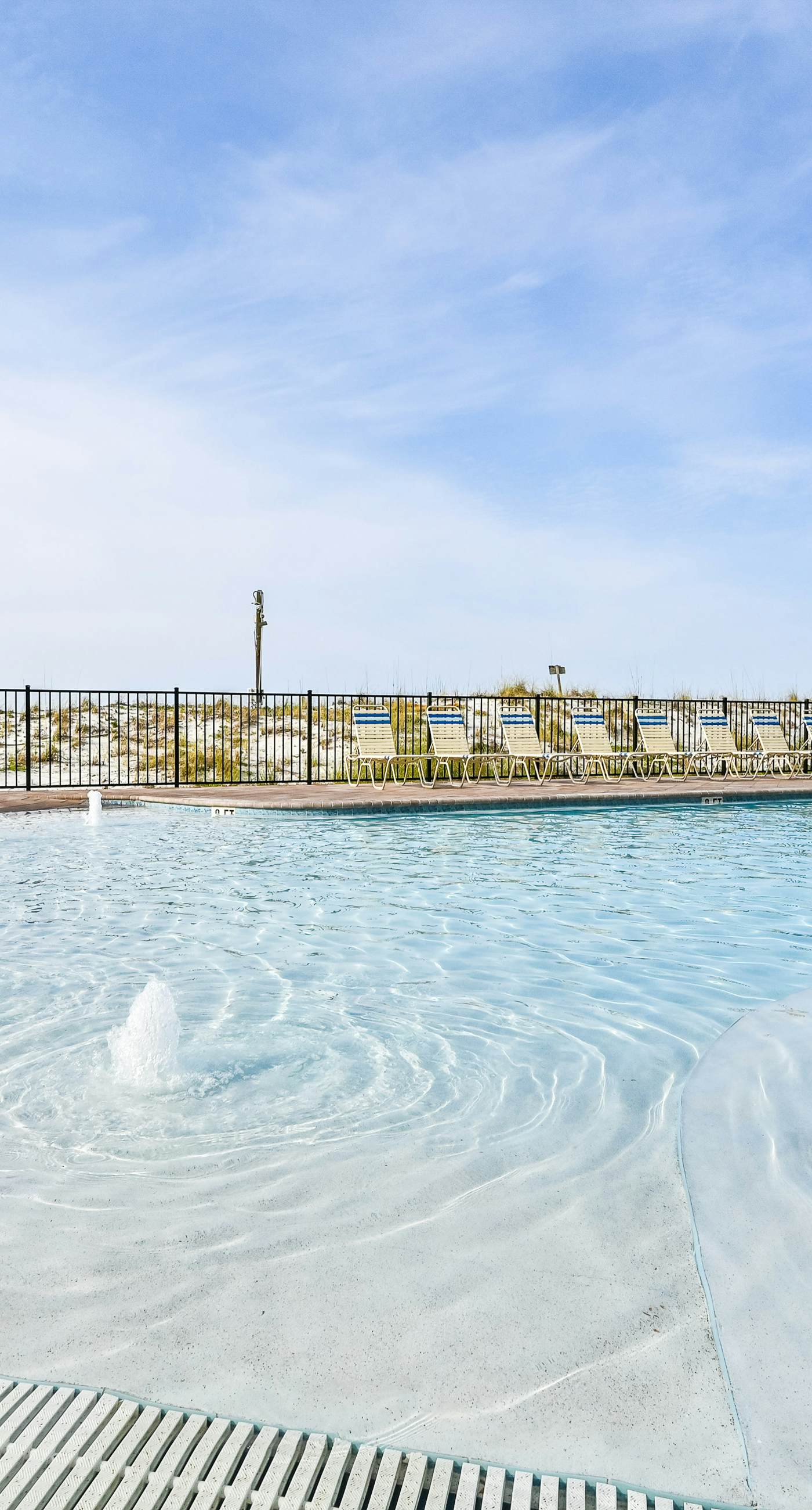 High-rise condo with ocean views, pool & balcony