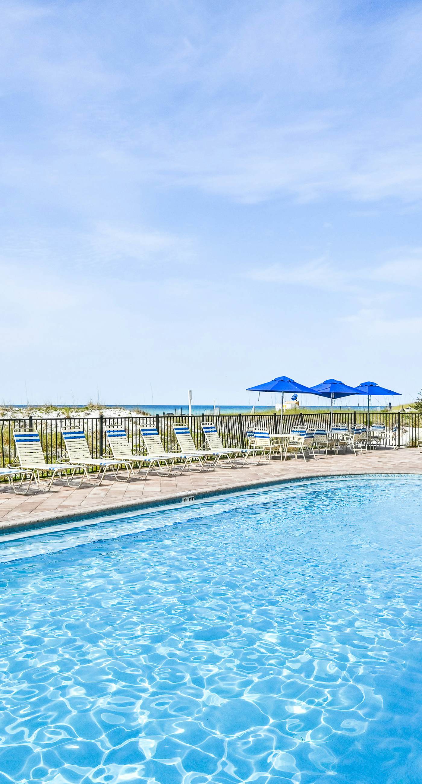 High-rise condo with ocean views, pool & balcony