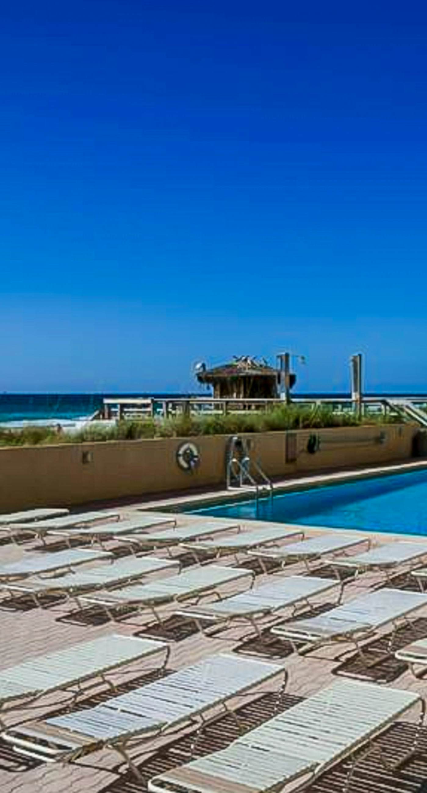 Spacious oceanfront condo with pool on-site, ocean view, WiFi & central AC