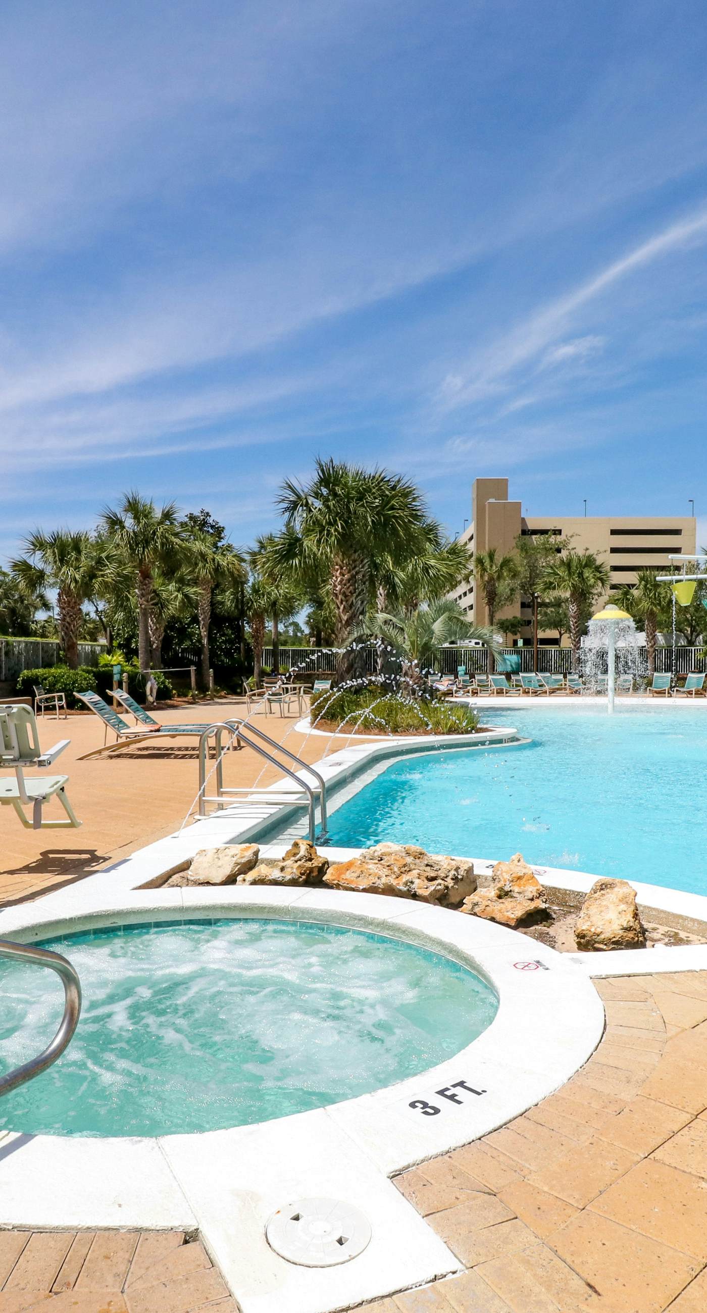 Beachfront resort condo with gulf views, pools,splash pad, hot tub, & gym