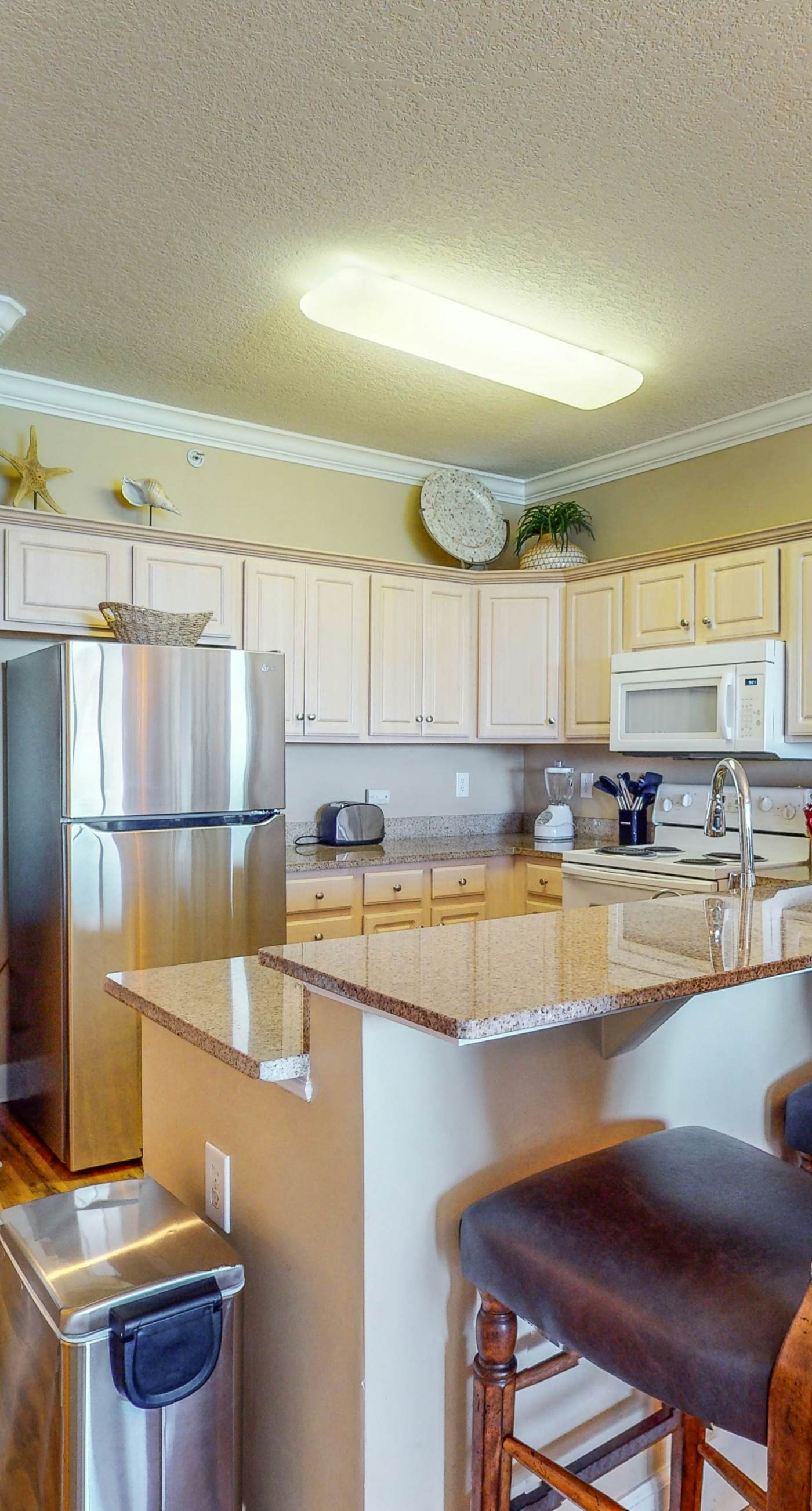 Waterfront condo in a resort setting w/ shared pools, hot tub, & beach access