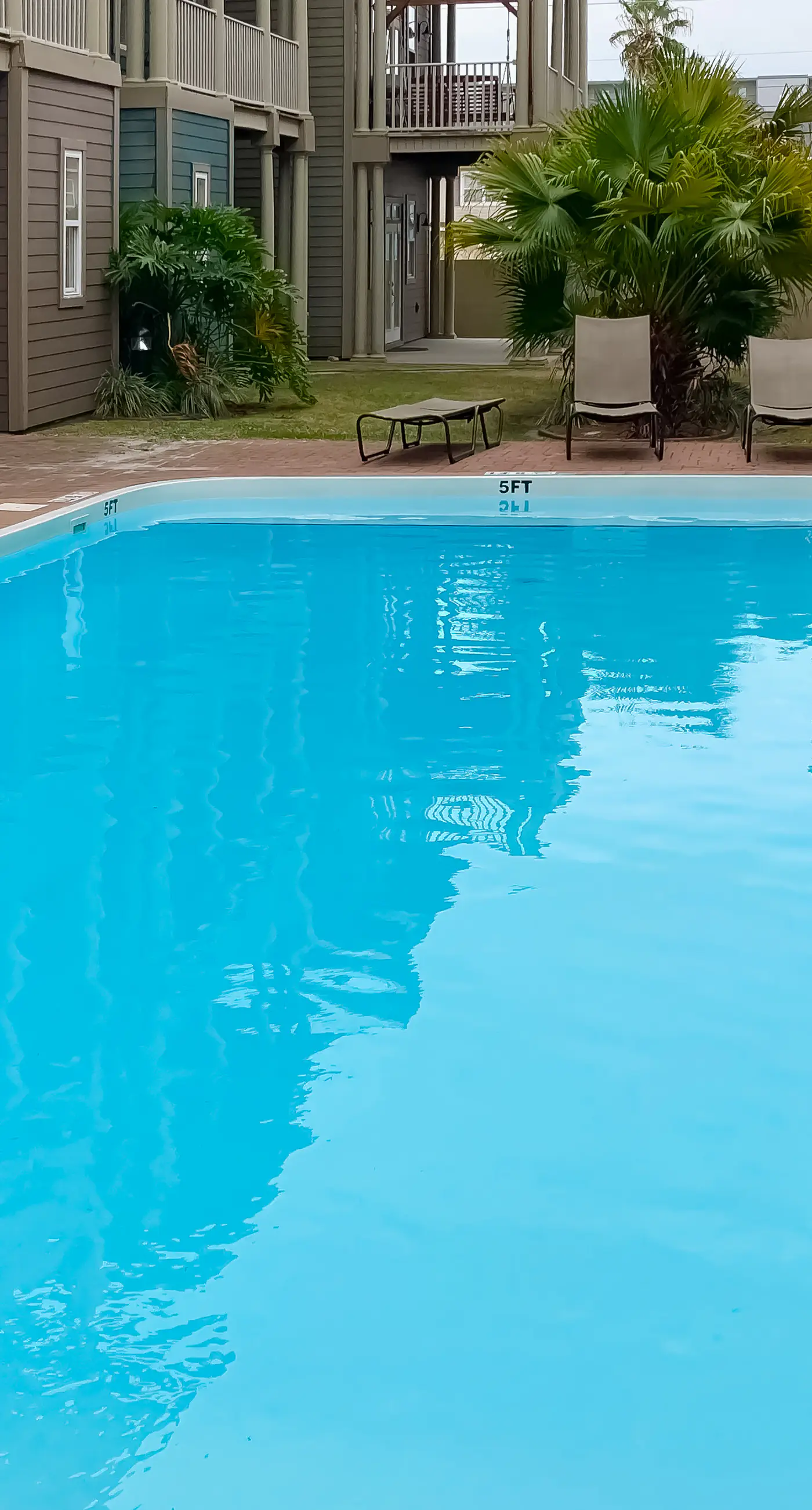Dog-friendly home with balconies, foosball, pool access, & W&D - steps to beach