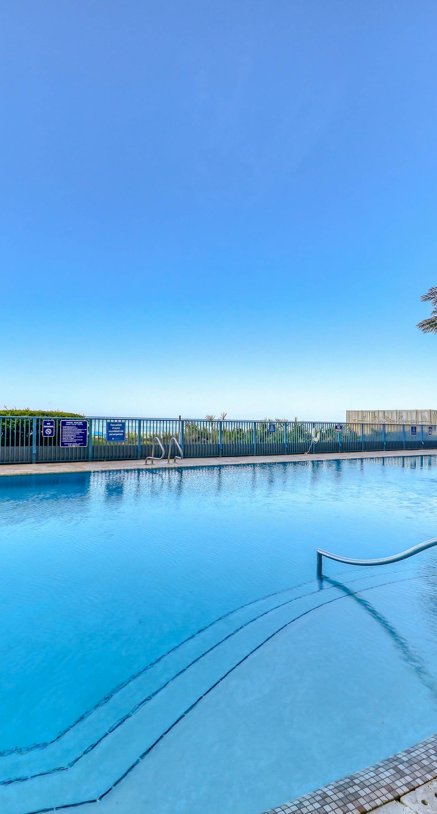 Updated beachfront retreat with hot tub, outdoor pool & balcony