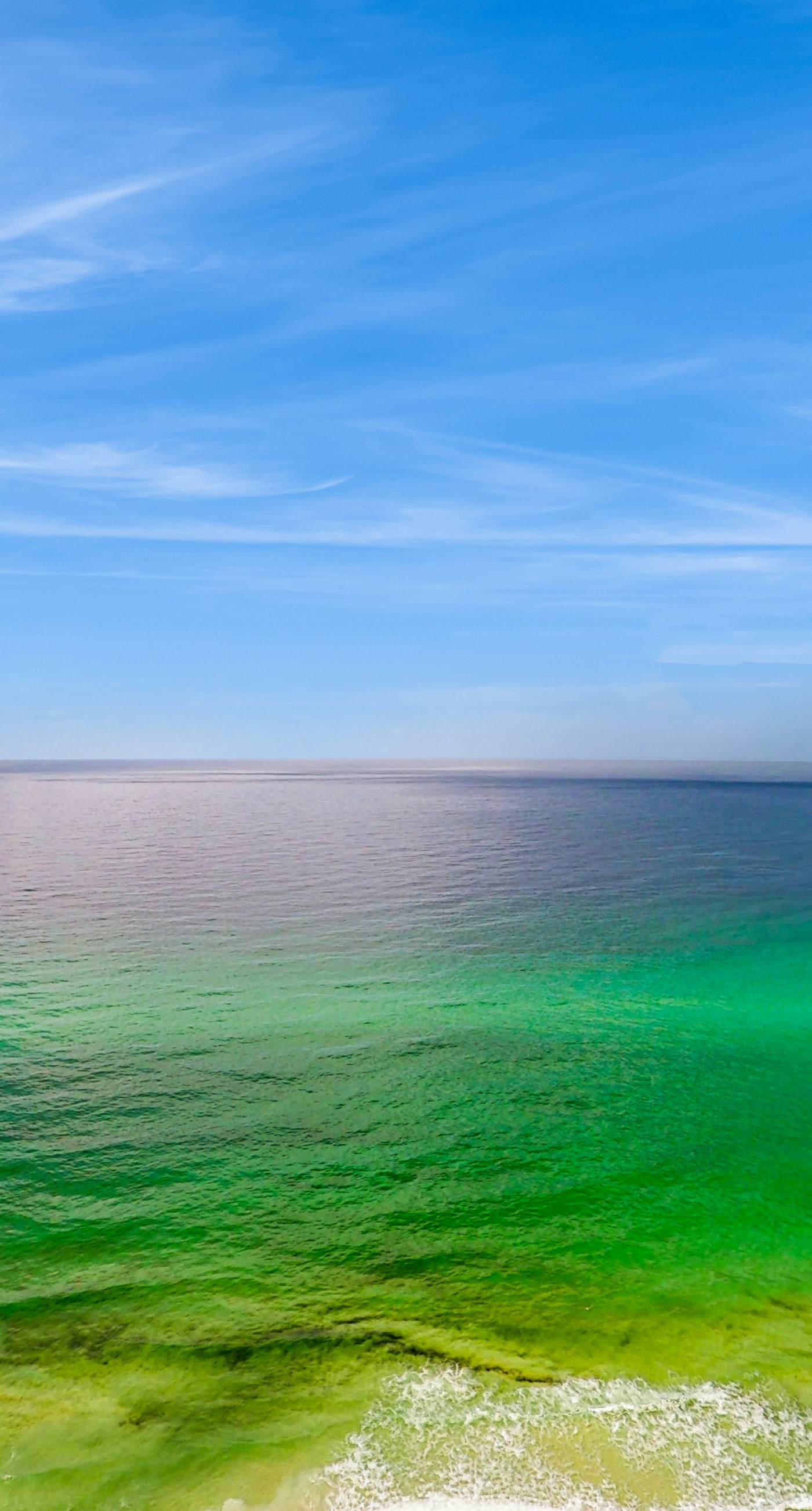 Updated beachfront retreat with hot tub, outdoor pool & balcony