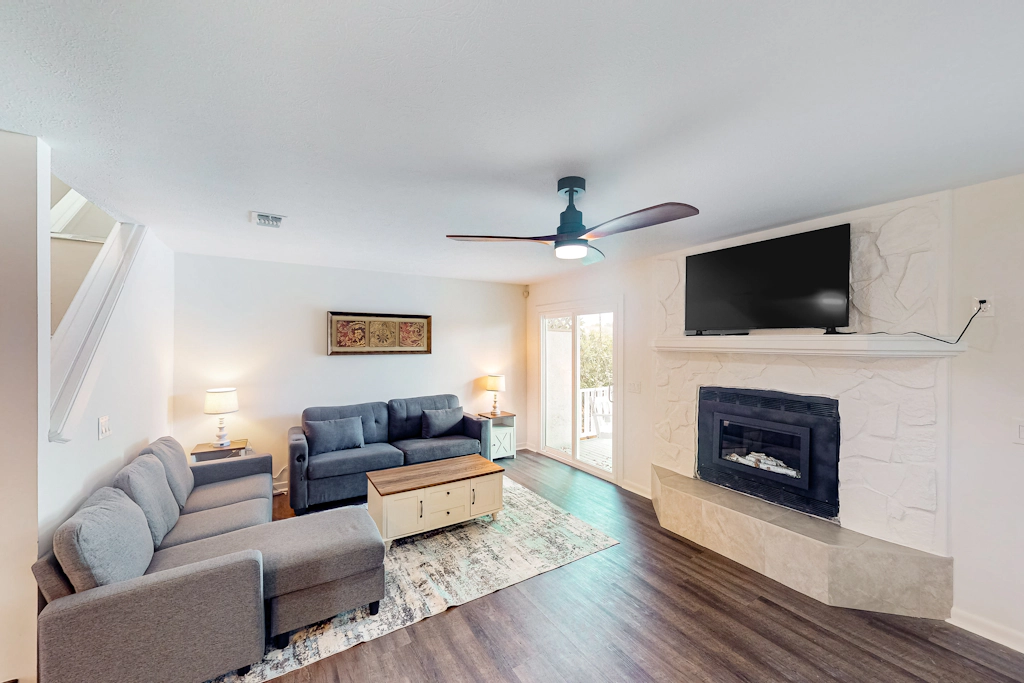 Two-story waterfront retreat with a furnished deck, washer/dryer, & AC