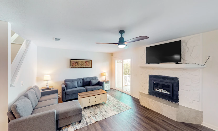 Two-story waterfront retreat with a furnished deck, washer/dryer, & AC