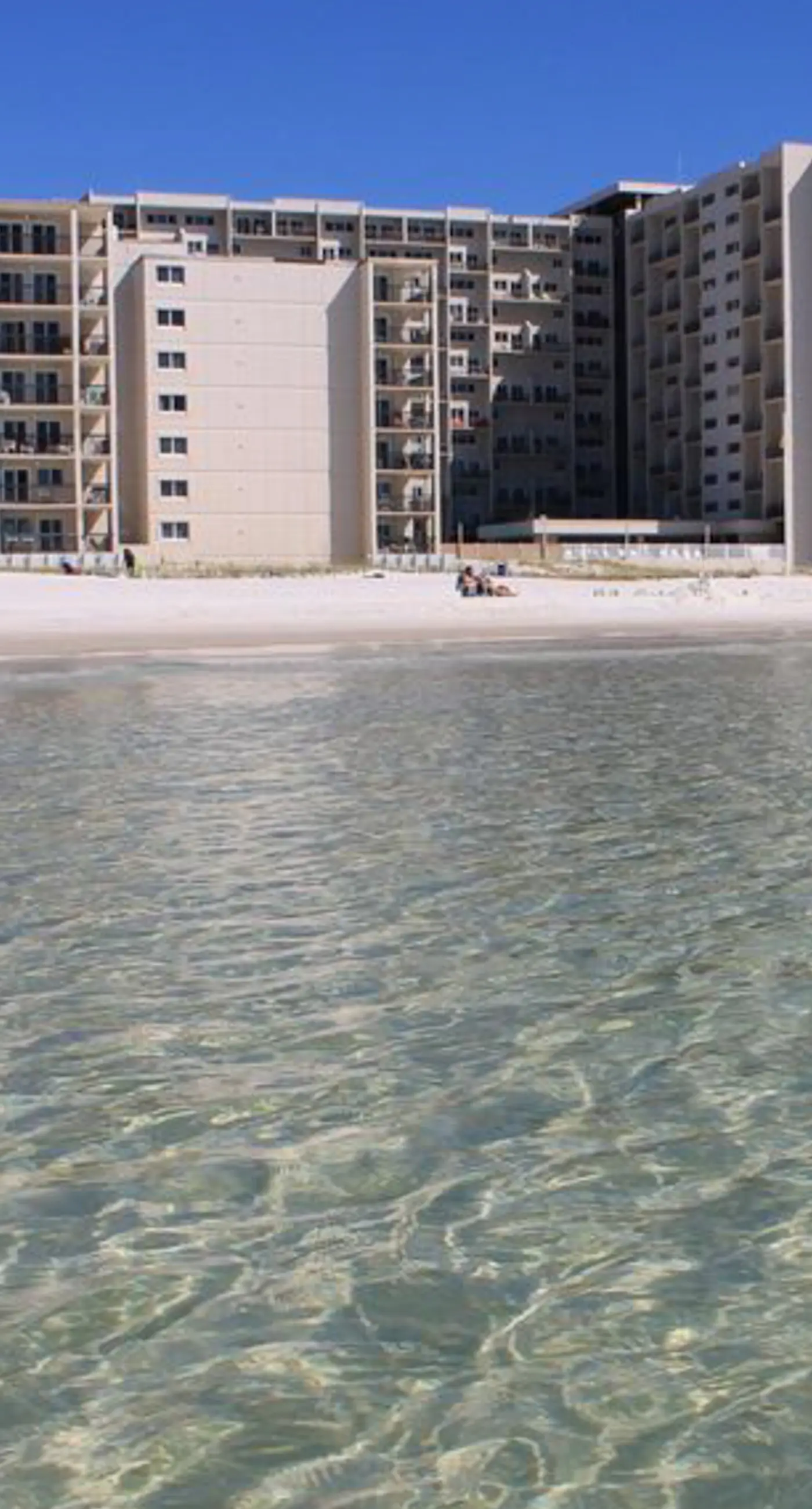 Beachfront condo with furnished balcony, pools, tennis courts, & hot tub