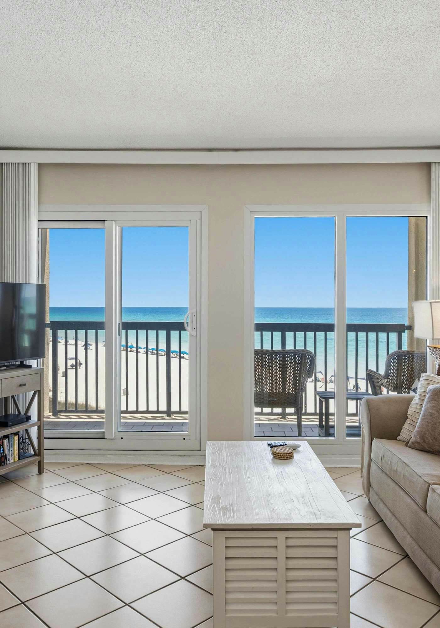 Beachfront condo with furnished balcony, pools, tennis courts, & hot tub