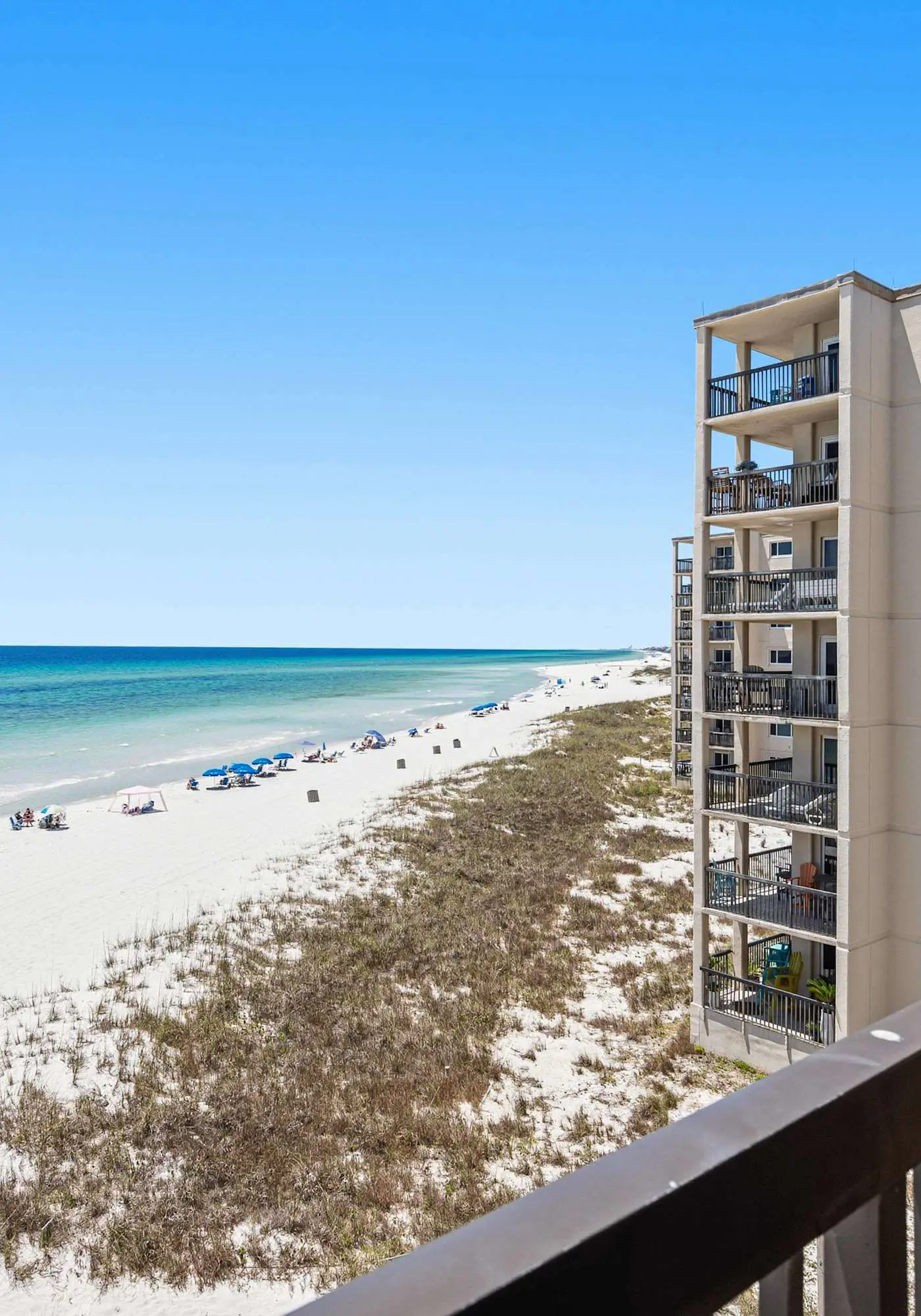 Beachfront condo with furnished balcony, pools, tennis courts, & hot tub