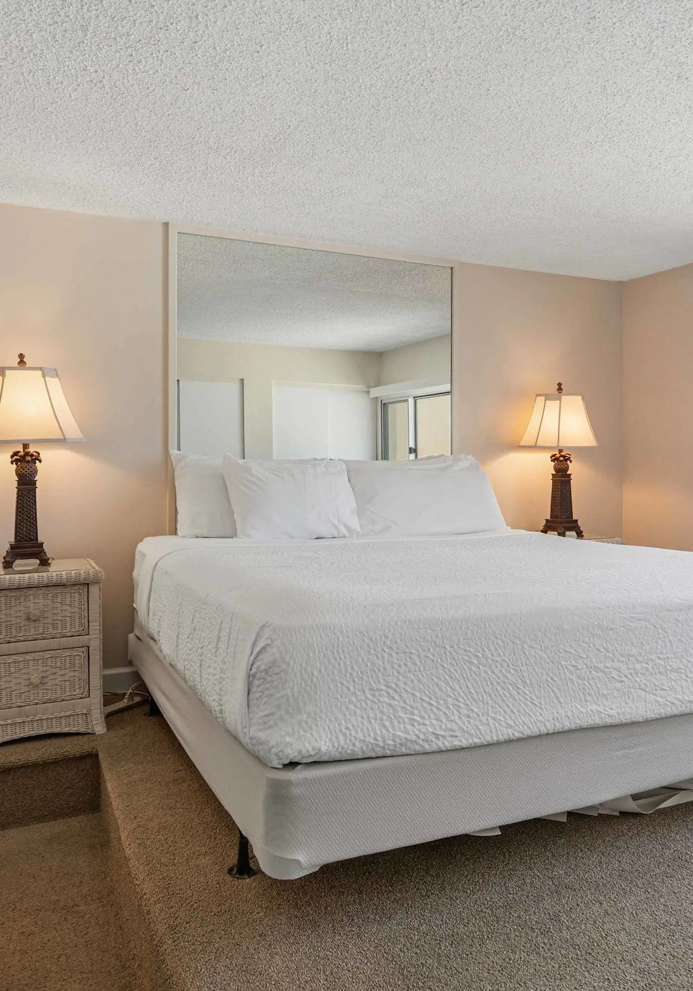 Beachfront condo with furnished balcony, pools, tennis courts, & hot tub