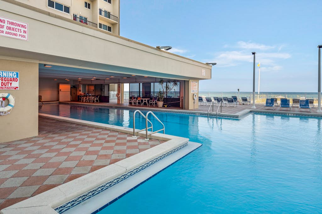 Cozy beachfront condo with private balcony, shared pool & beach access