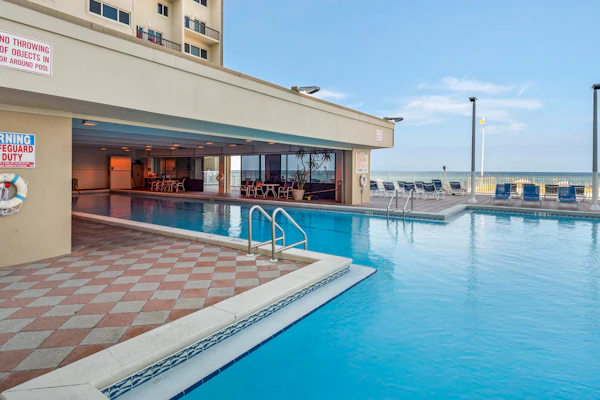 Cozy beachfront condo with private balcony, shared pool & beach access