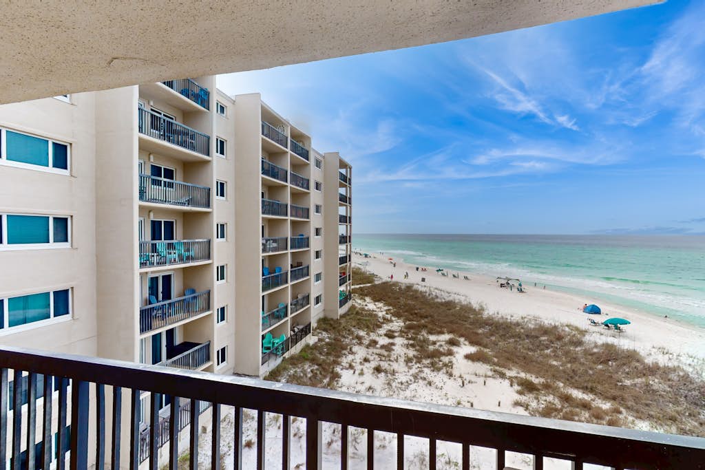 Cozy beachfront condo with private balcony, shared pool & beach access