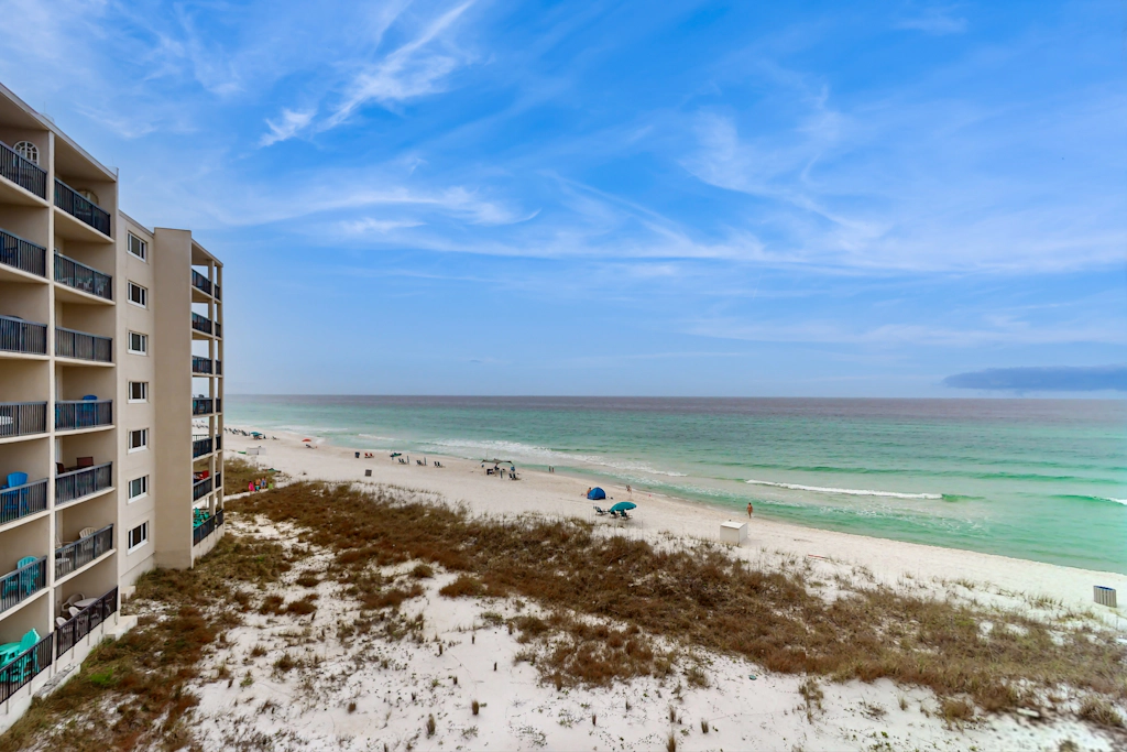 Cozy beachfront condo with private balcony, shared pool & beach access