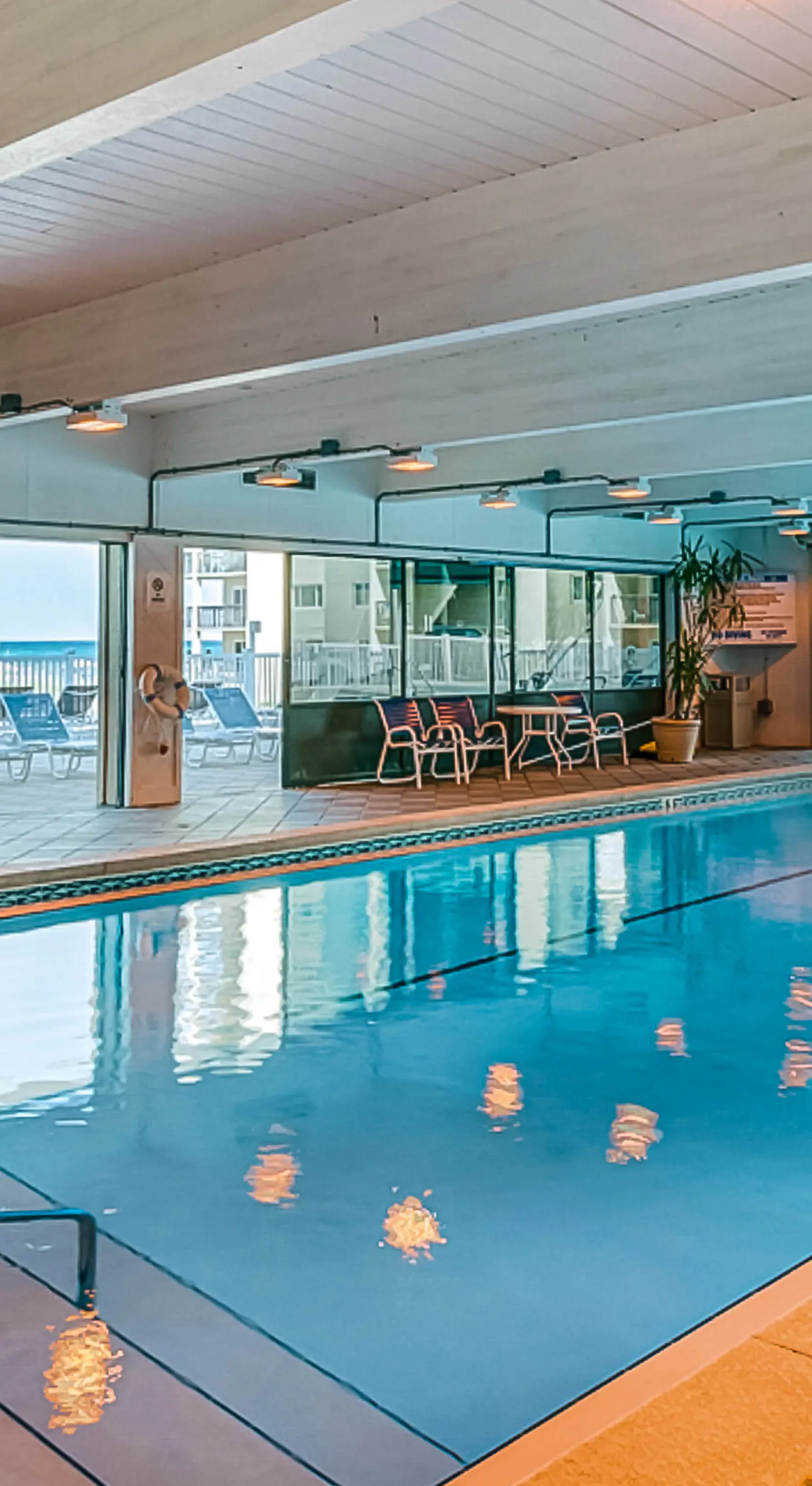 Beachfront condo with balcony, pools, sauna & ocean views - snowbird-friendly