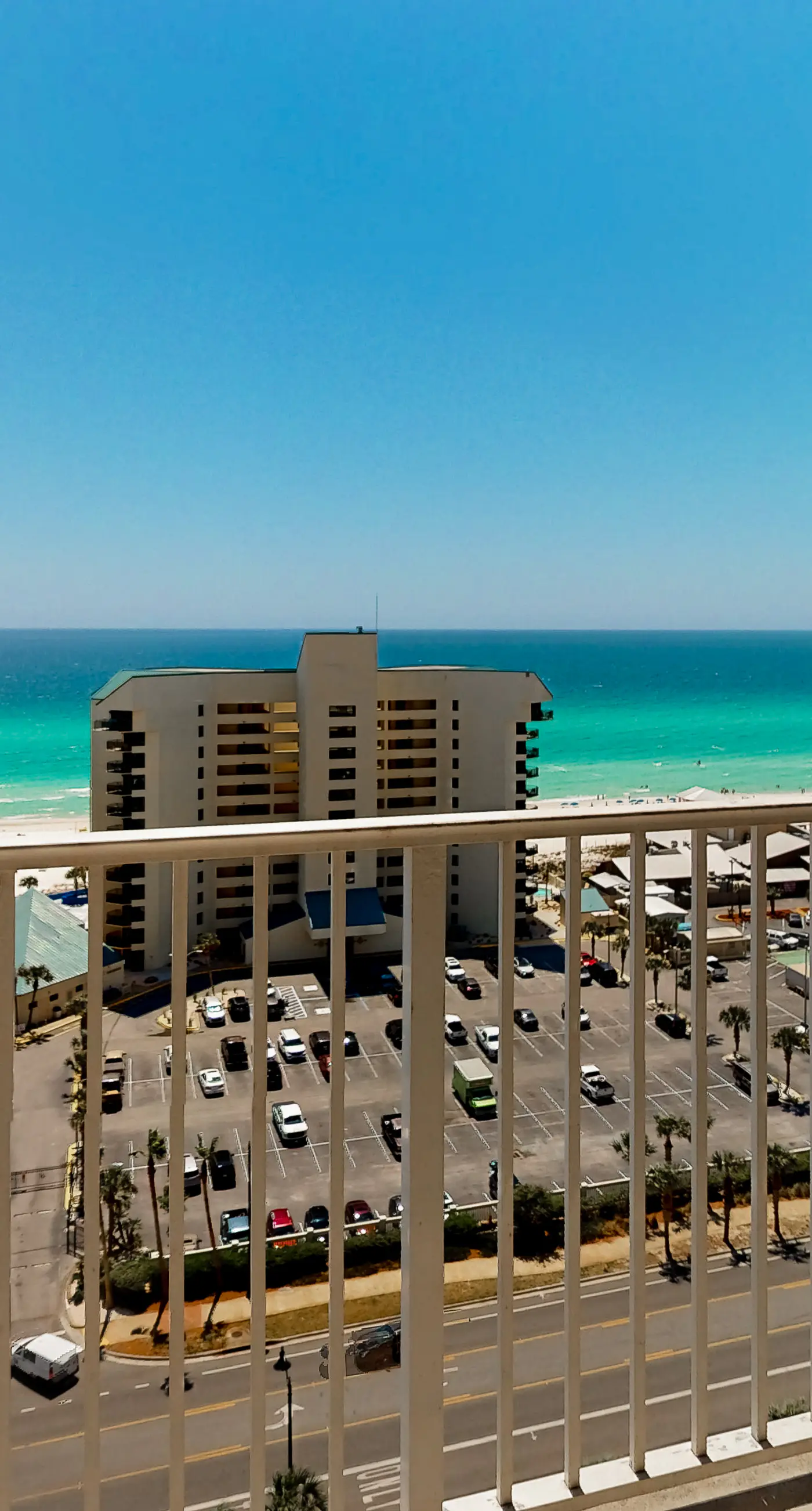 Gulf-view condo steps to beach with balcony, pools, hot tub & gym