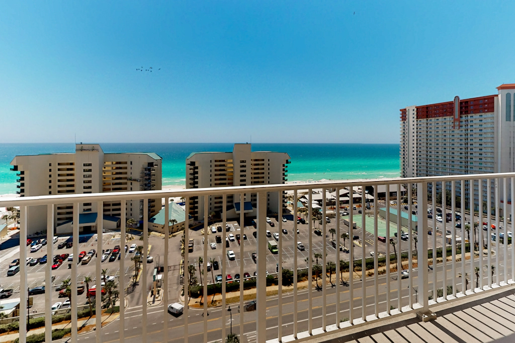 Gulf-view condo steps to beach with balcony, pools, hot tub & gym