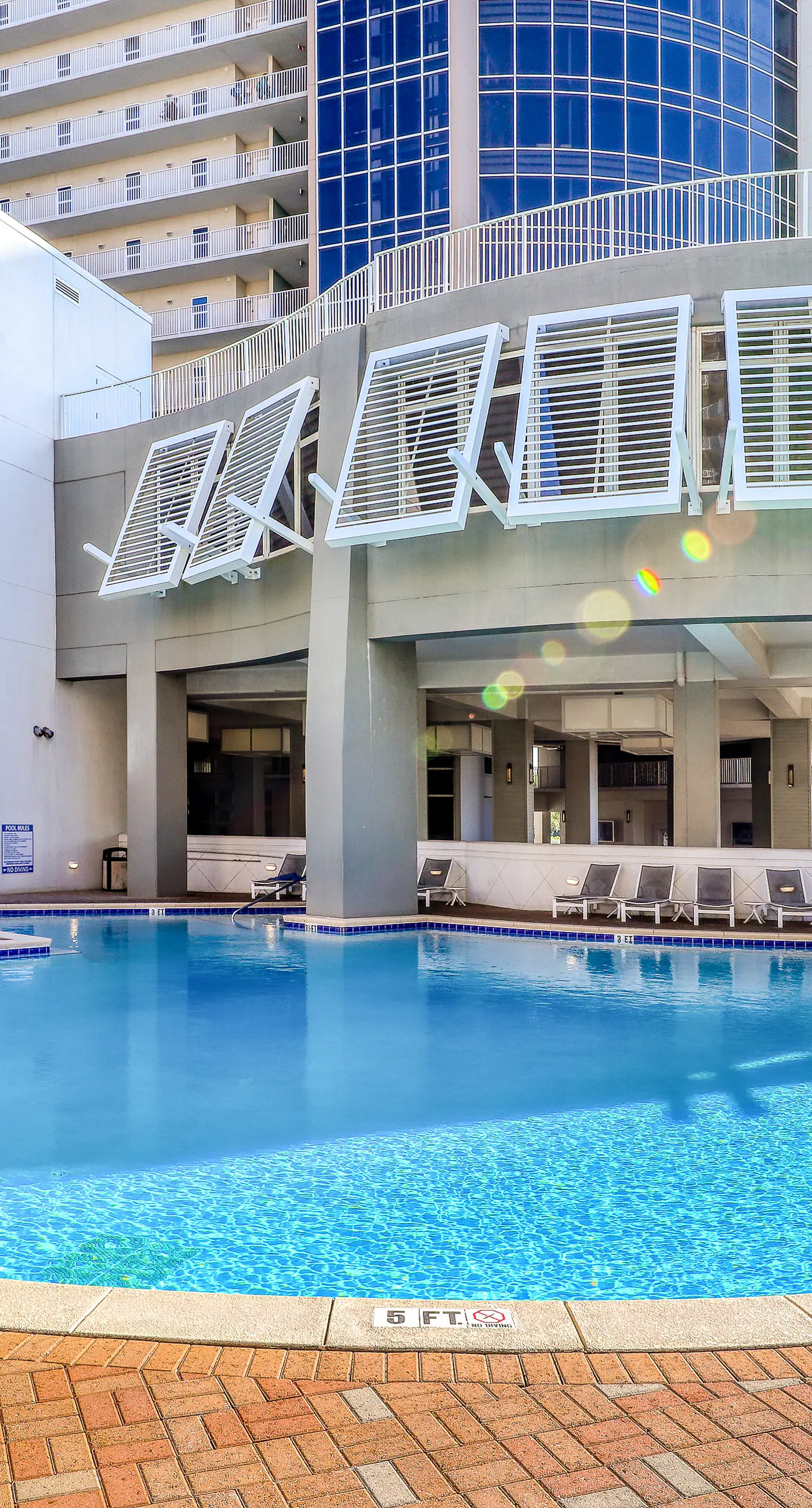 Gulf-view condo steps to beach with balcony, pools, hot tub & gym