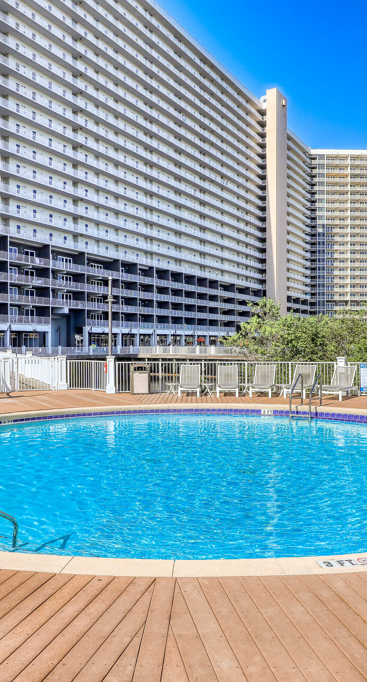 Gulf-view condo steps to beach with balcony, pools, hot tub & gym