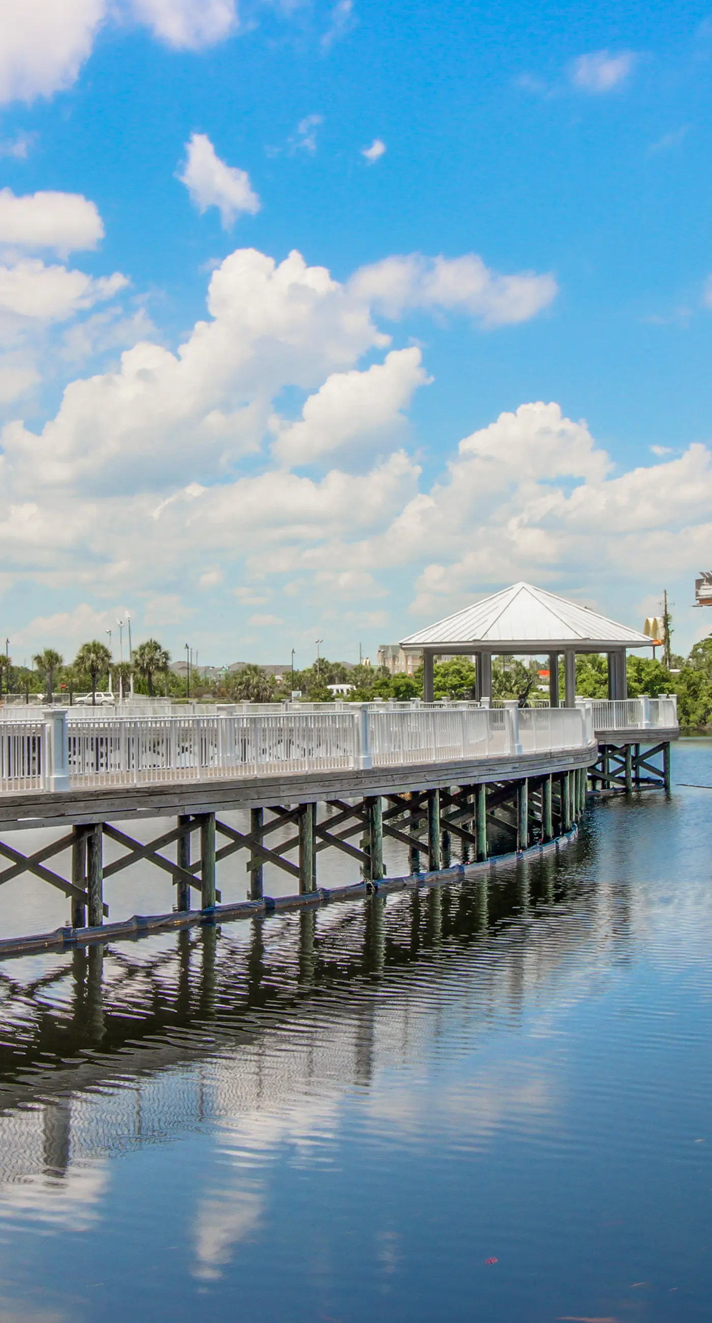 Gulf-view condo steps to beach with balcony, pools, hot tub & gym