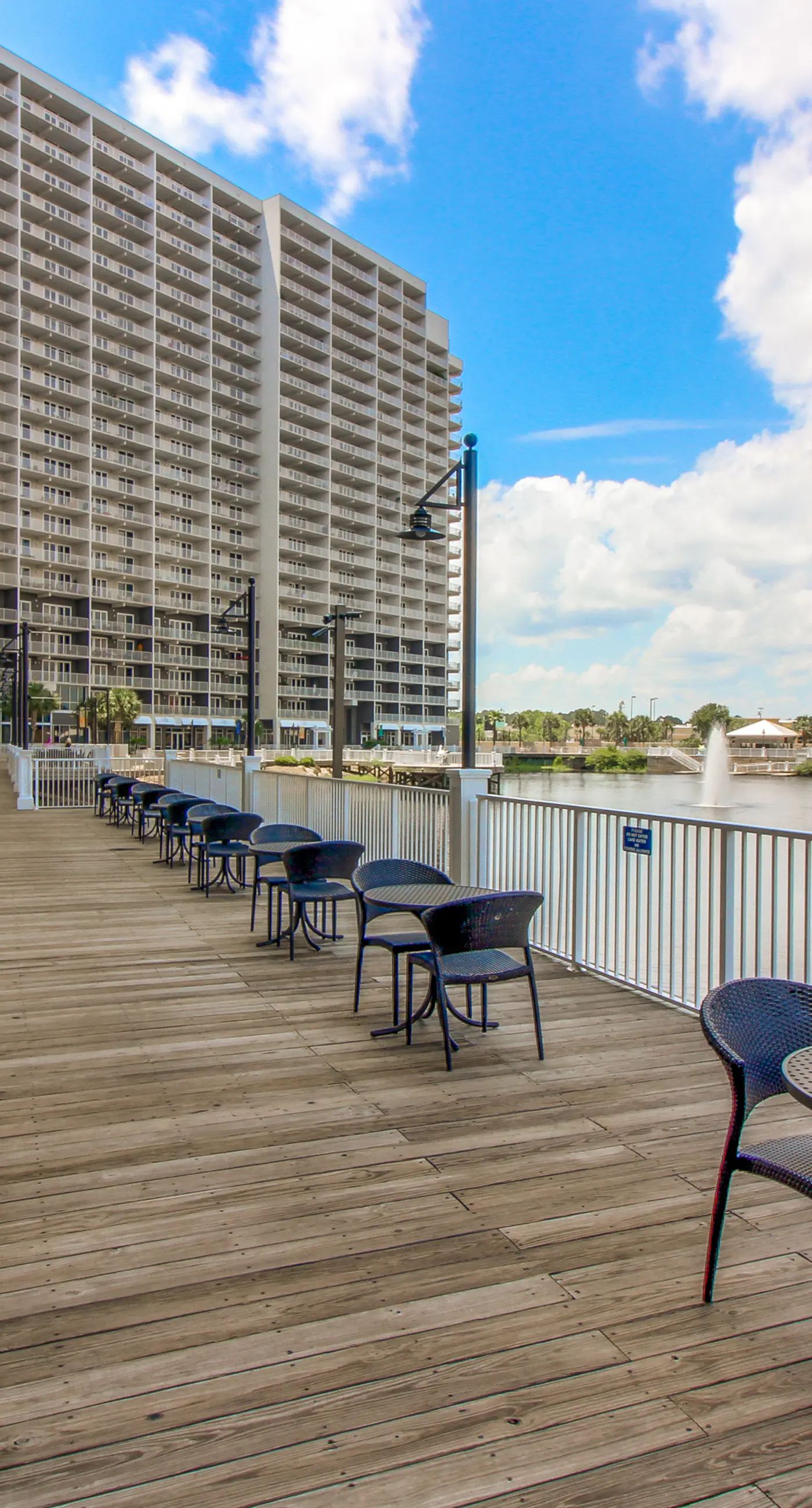 Gulf-view condo steps to beach with balcony, pools, hot tub & gym