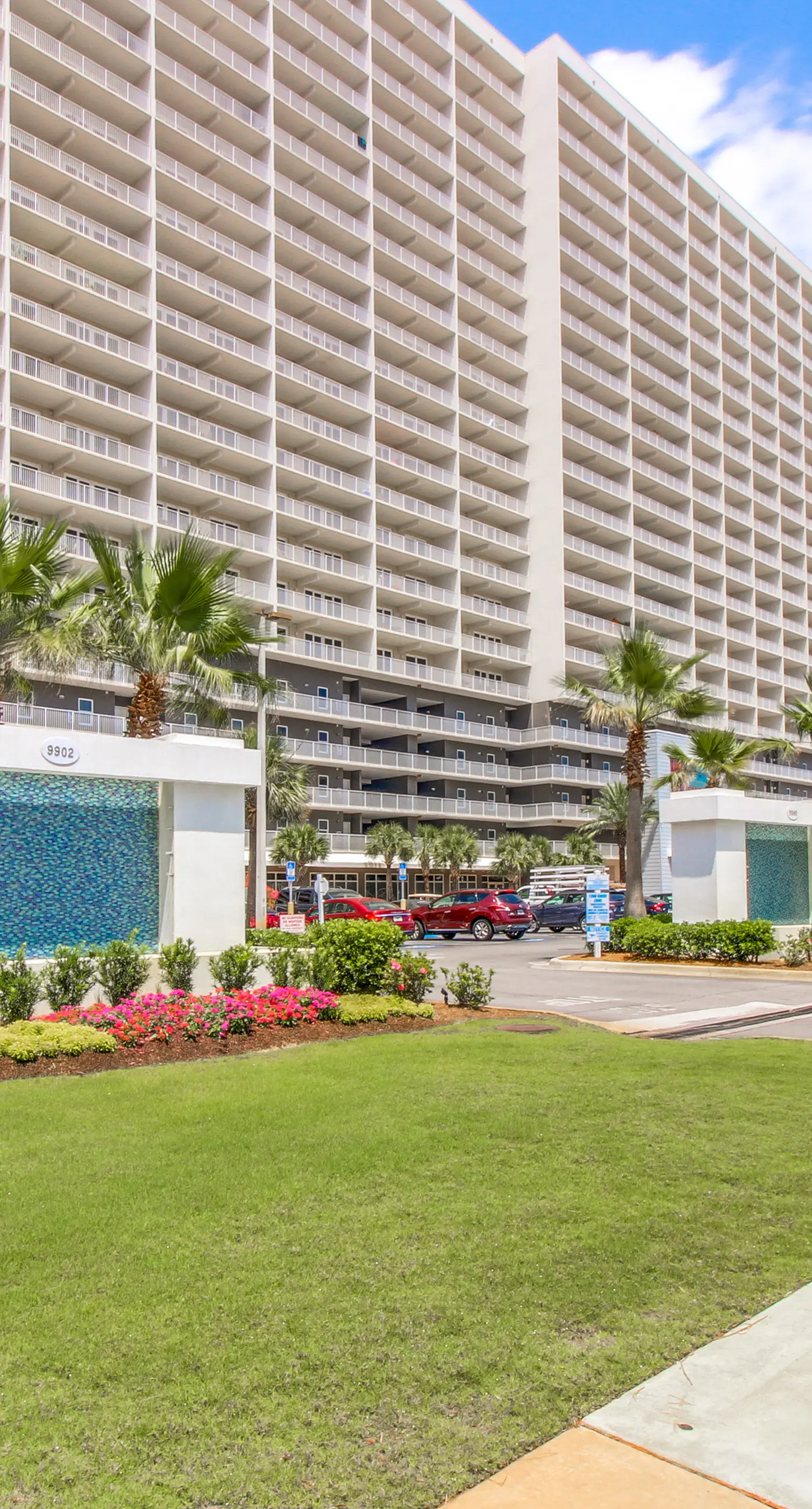 Gulf-view condo steps to beach with balcony, pools, hot tub & gym