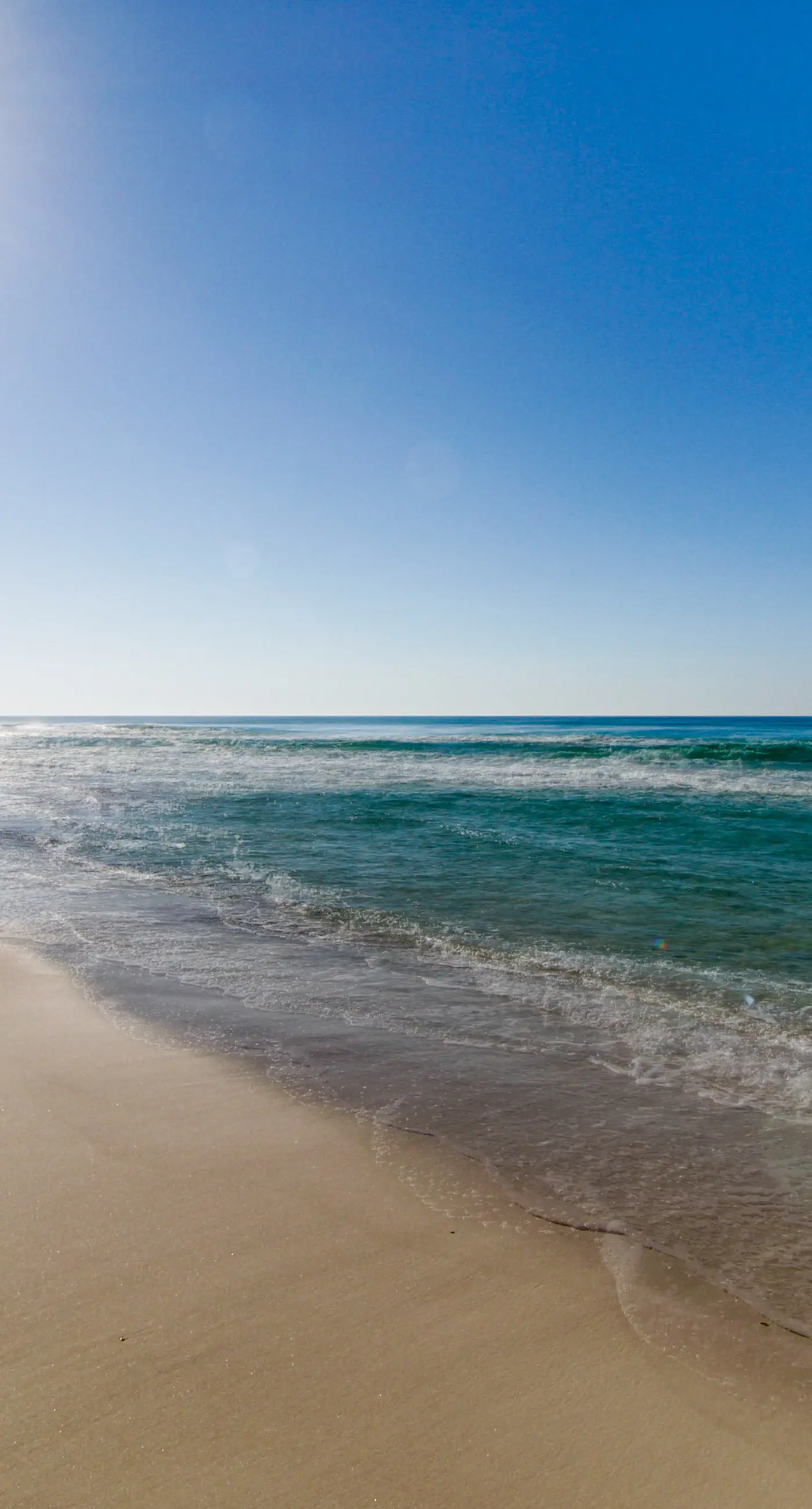 Gulf-view condo steps to beach with balcony, pools, hot tub & gym