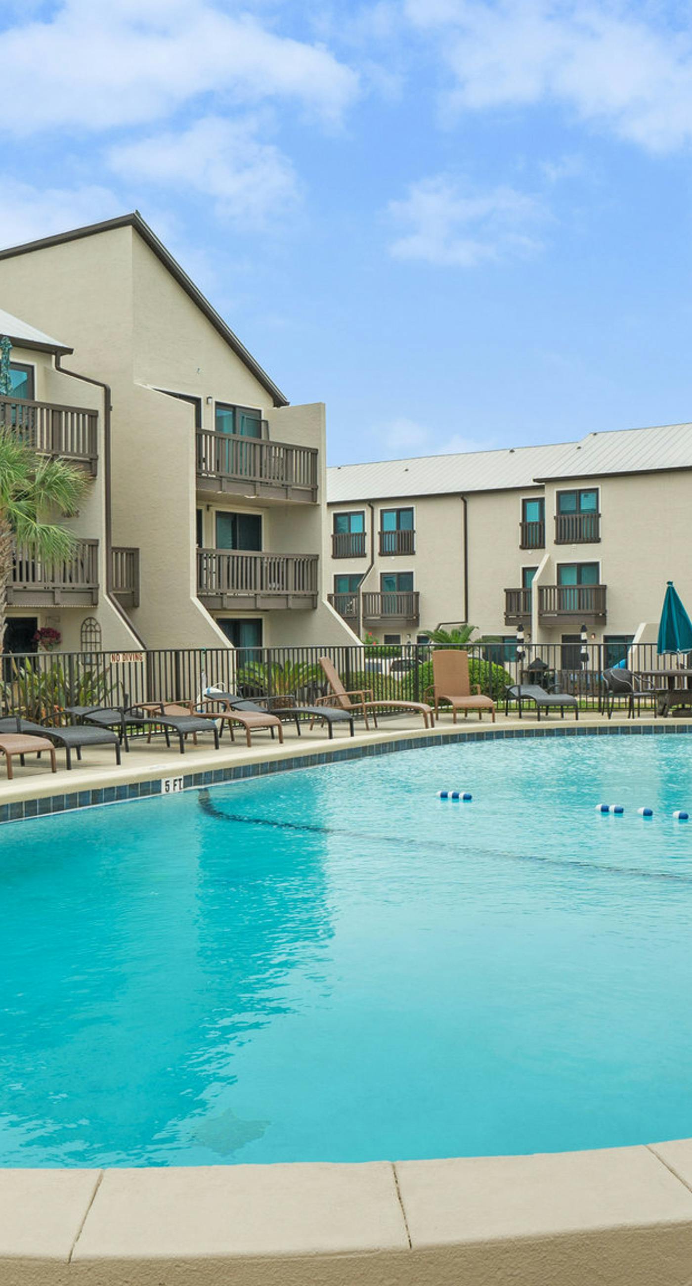 Three-story condo in beachfront complex with patios, balconies, pool & hot tub