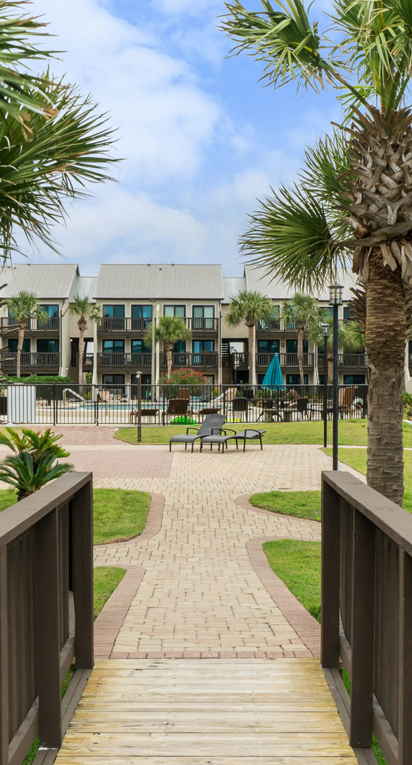 Three-story condo in beachfront complex with patios, balconies, pool & hot tub
