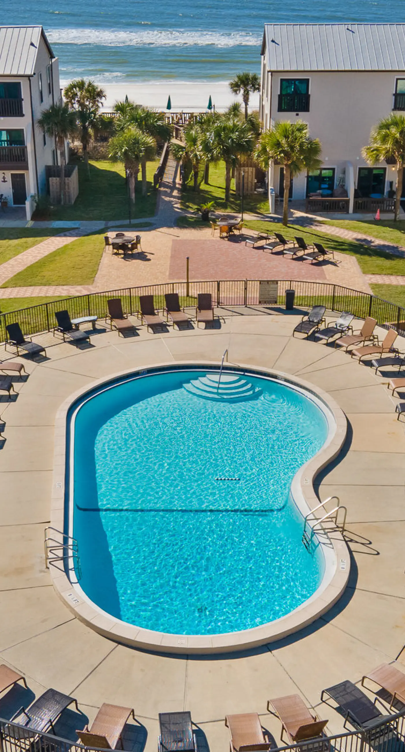 Three-story condo in beachfront complex with patios, balconies, pool & hot tub