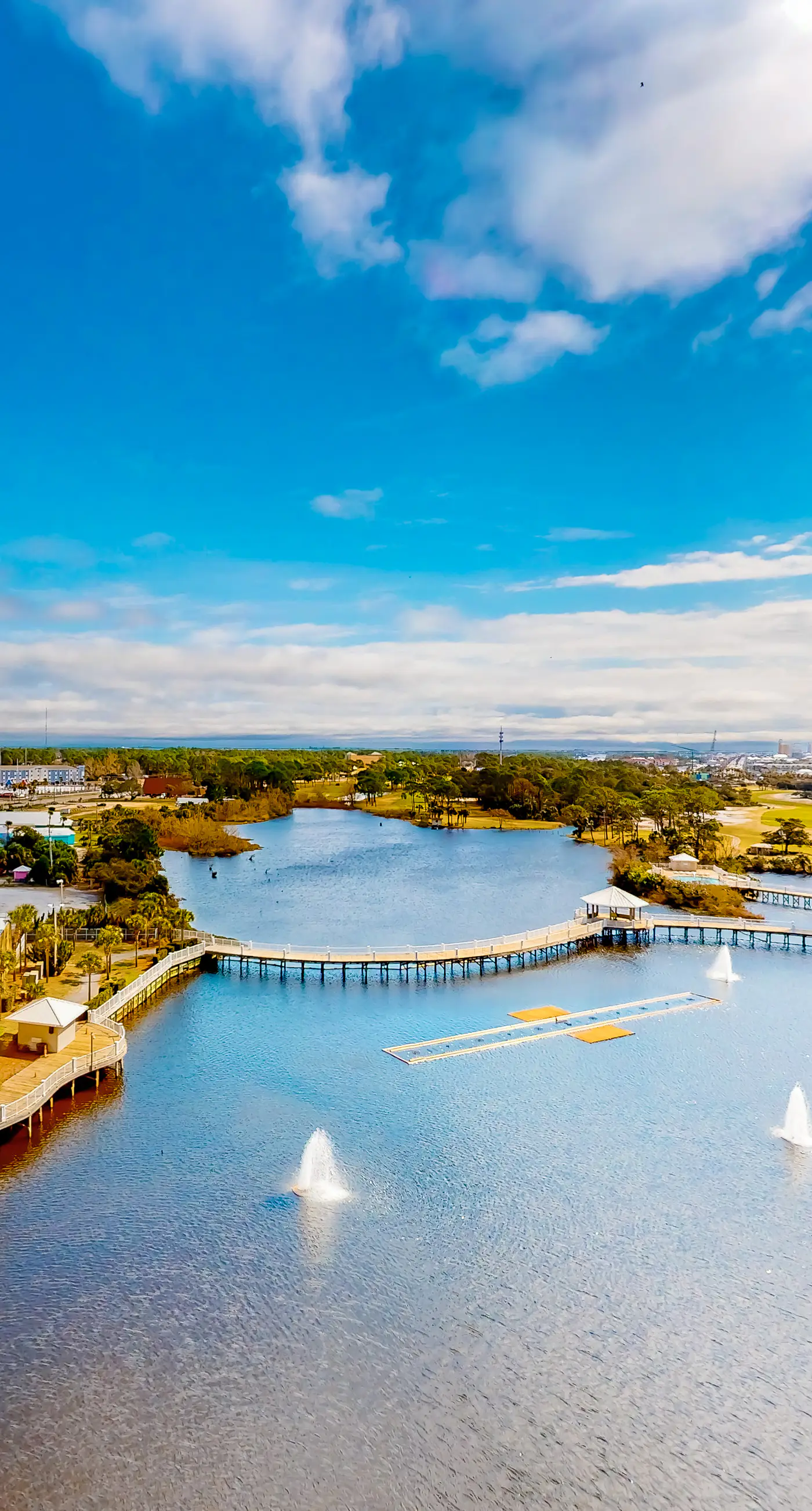 Waterfront condo with lake views, on-site pools, putting green & shopping/dining