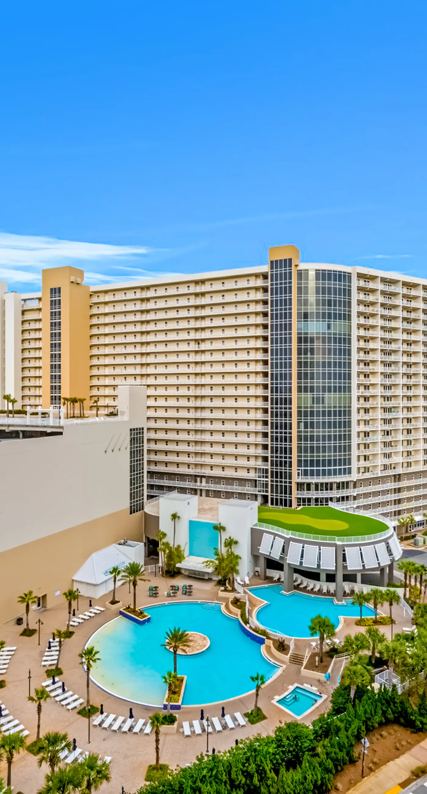 Inviting waterfront condo with pool, hot tub, beach access, balcony, & WD