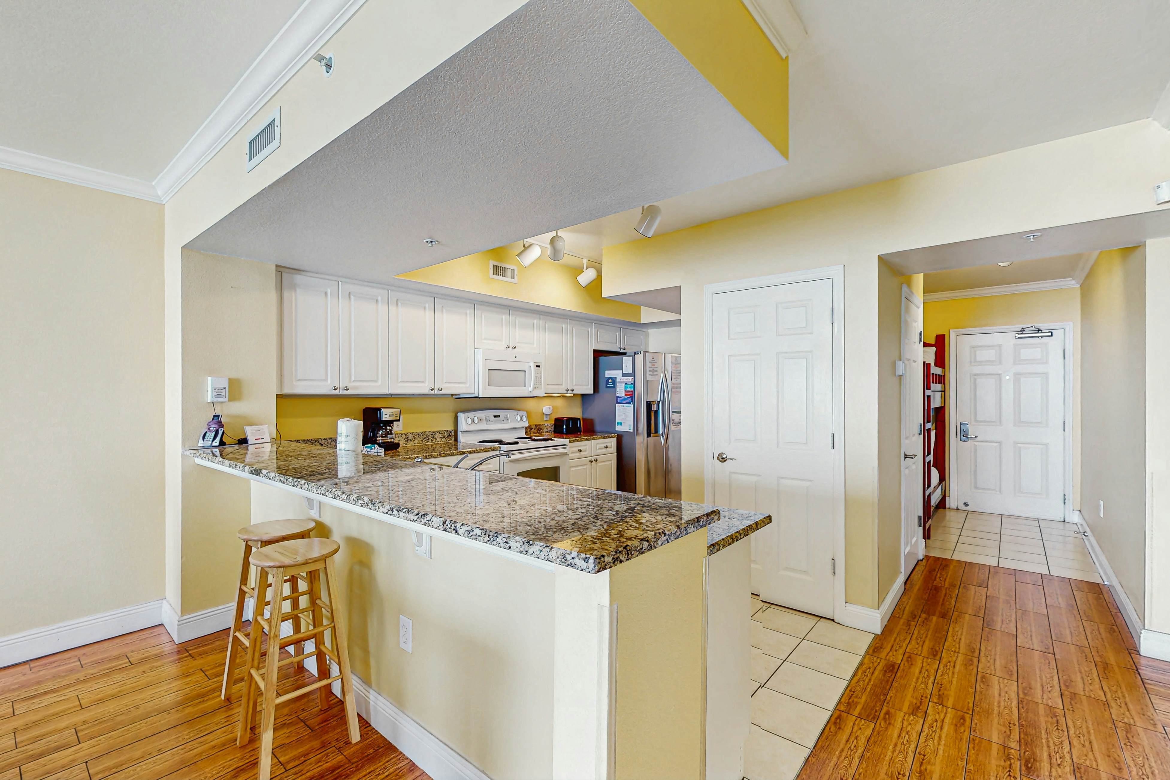 Roomy retreat on the water with private balcony, shared pool, & beach access