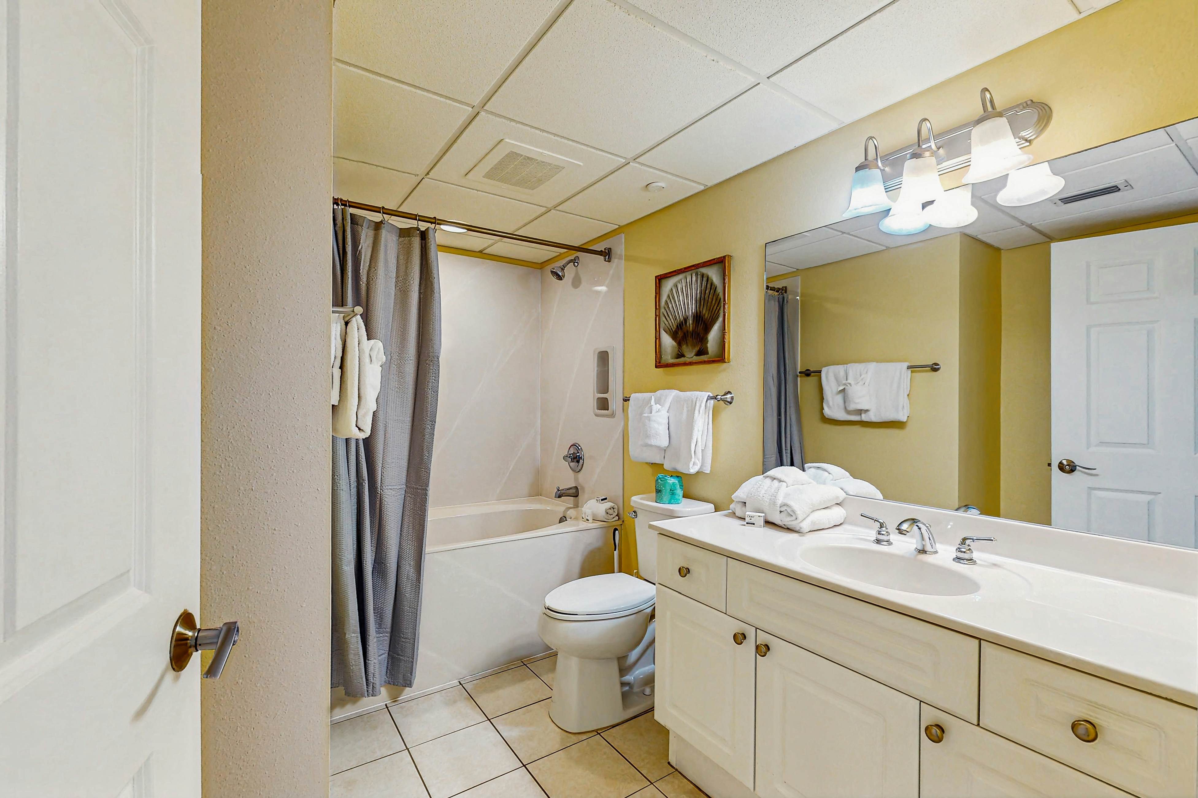 Roomy retreat on the water with private balcony, shared pool, & beach access