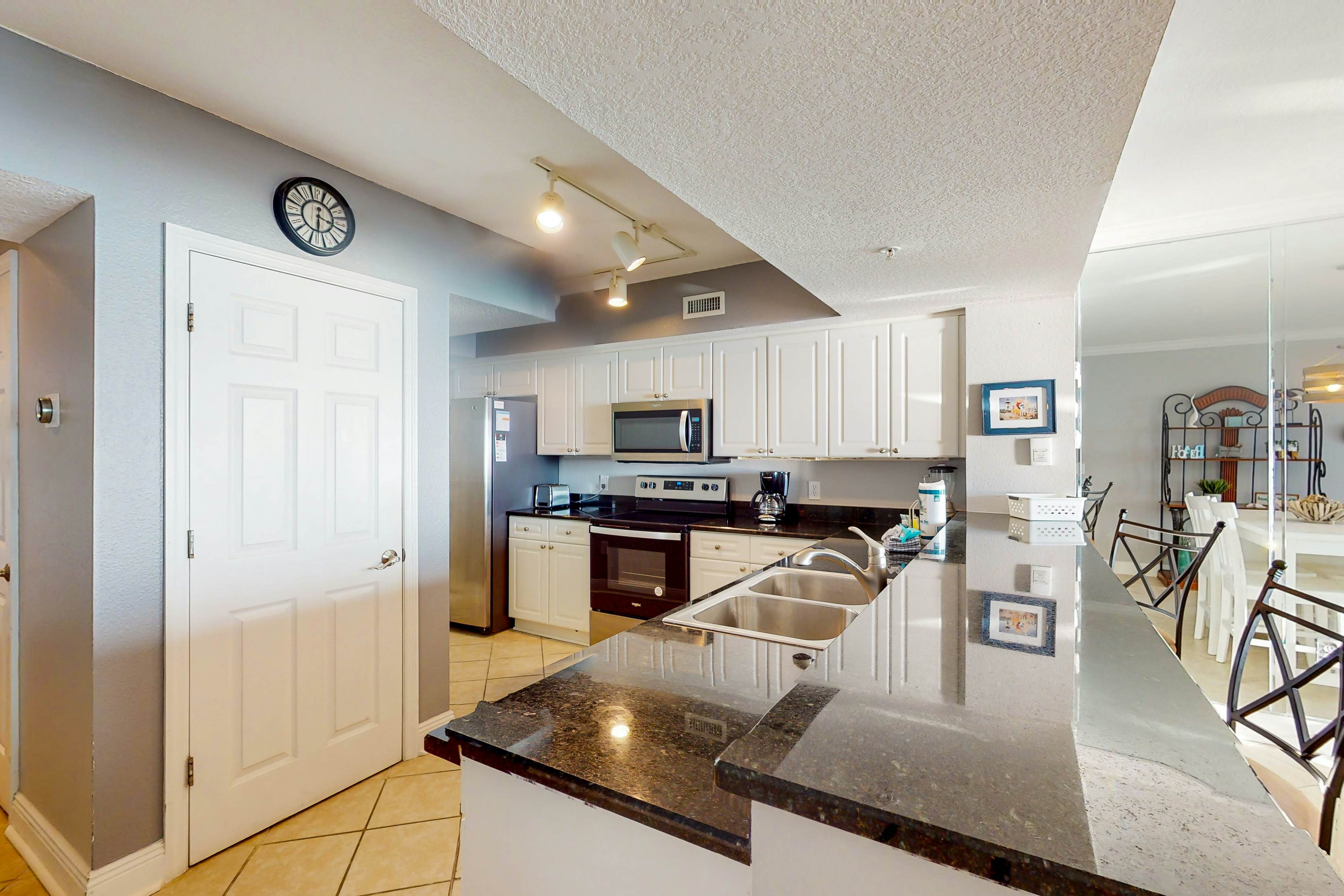 Resort condo on the beach with Gulf views, pools, hot tub, gym & game room