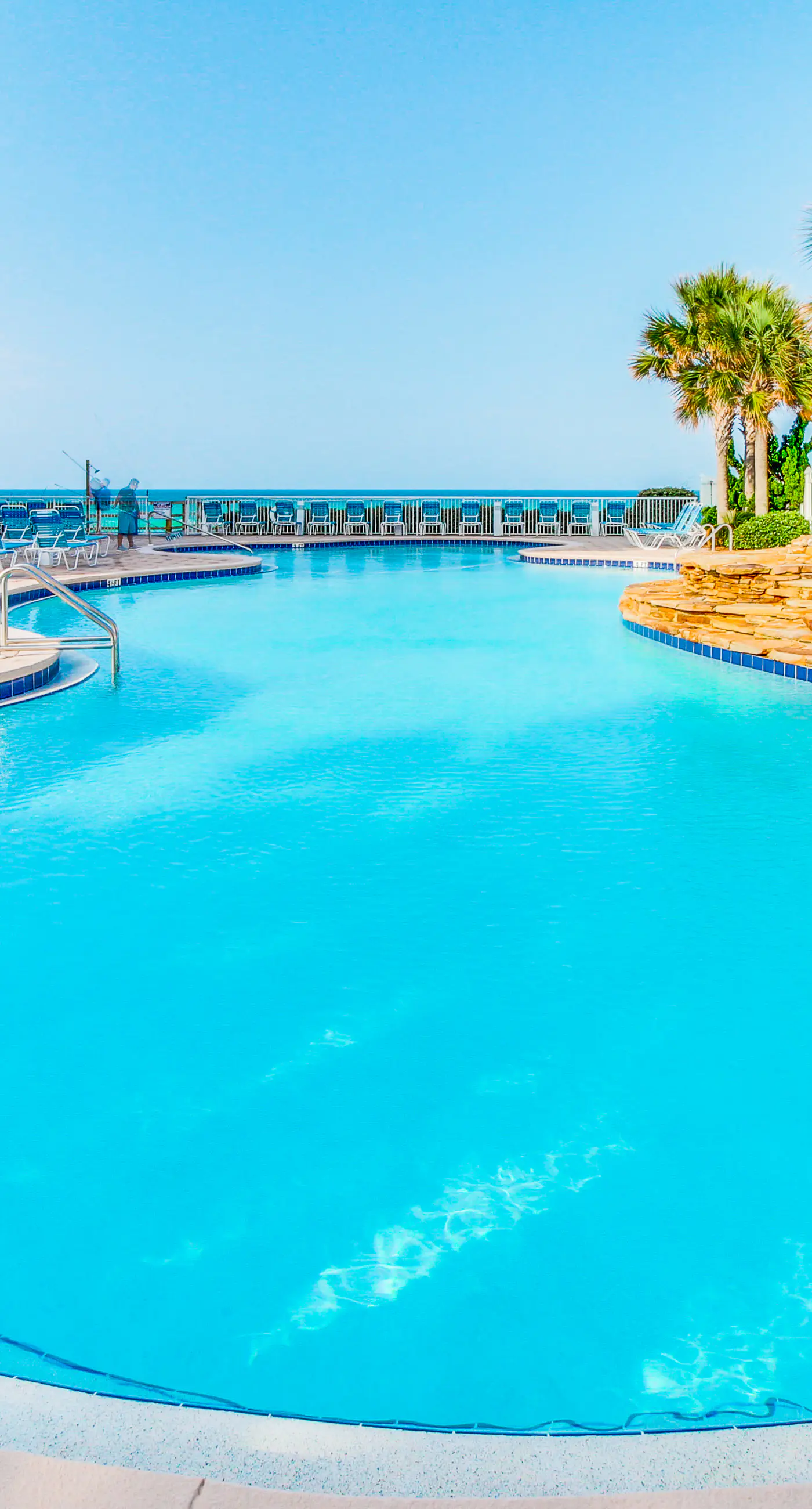 Sun-soaked oceanfront escape with pool, hot tub, central AC, & tennis court