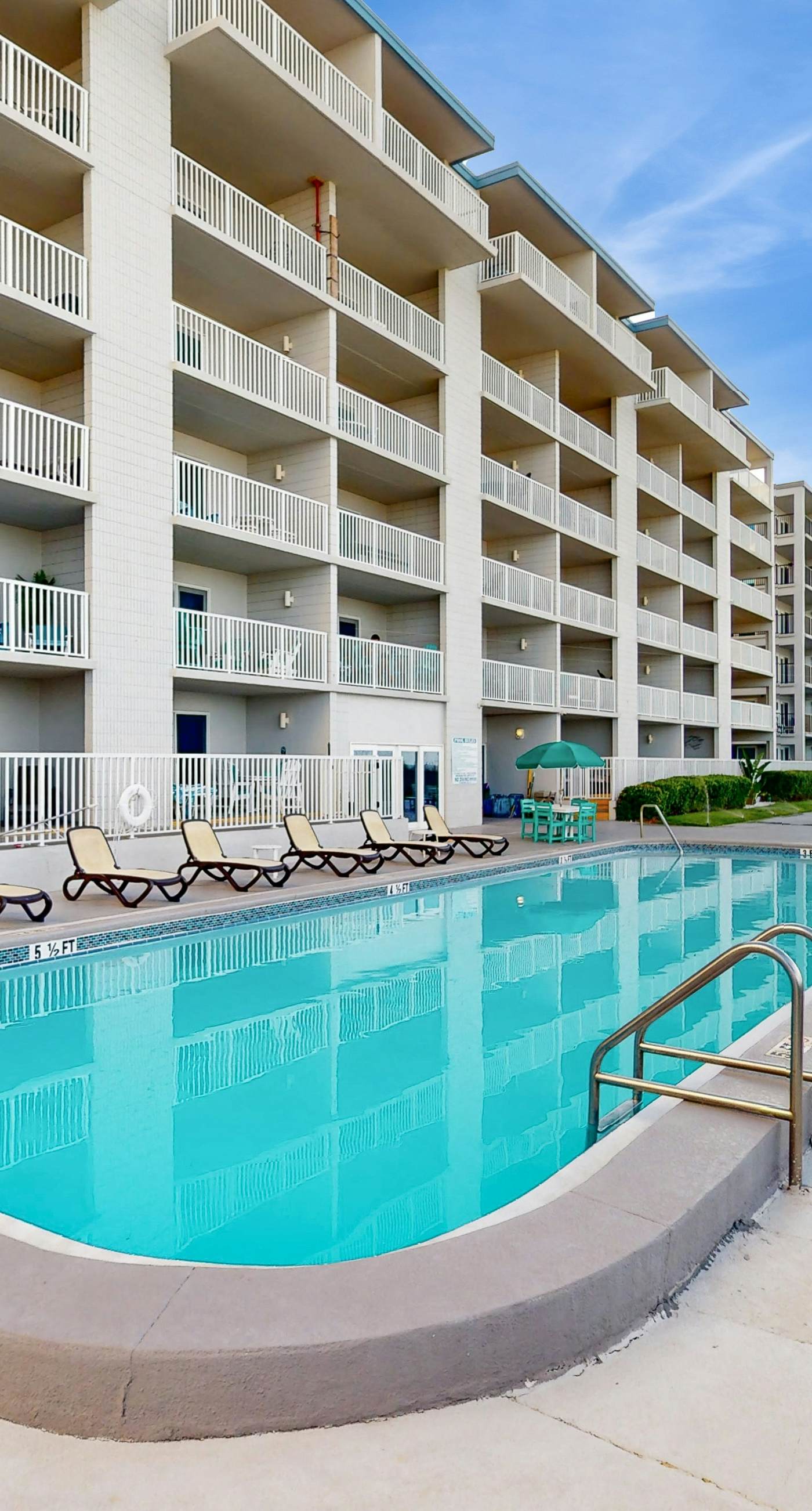 Oceanfront condo with shared pool, resort amenities, and private washer/dryer