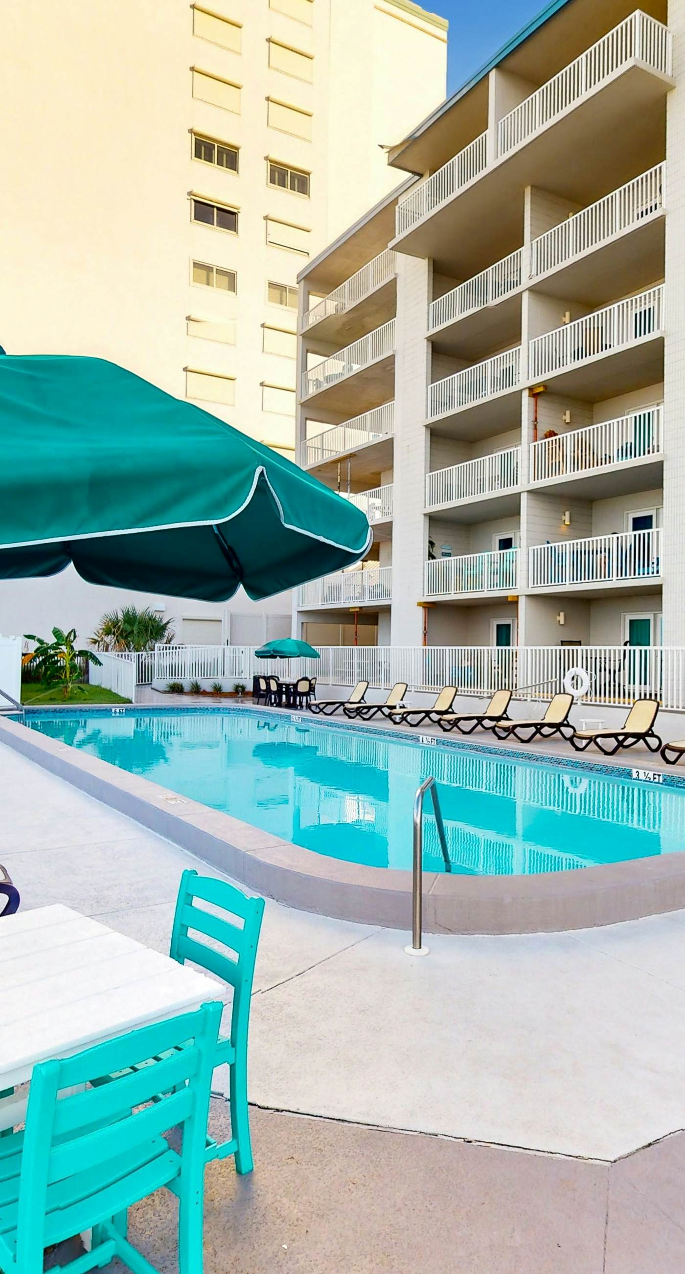 Oceanfront condo with shared pool, resort amenities, and private washer/dryer