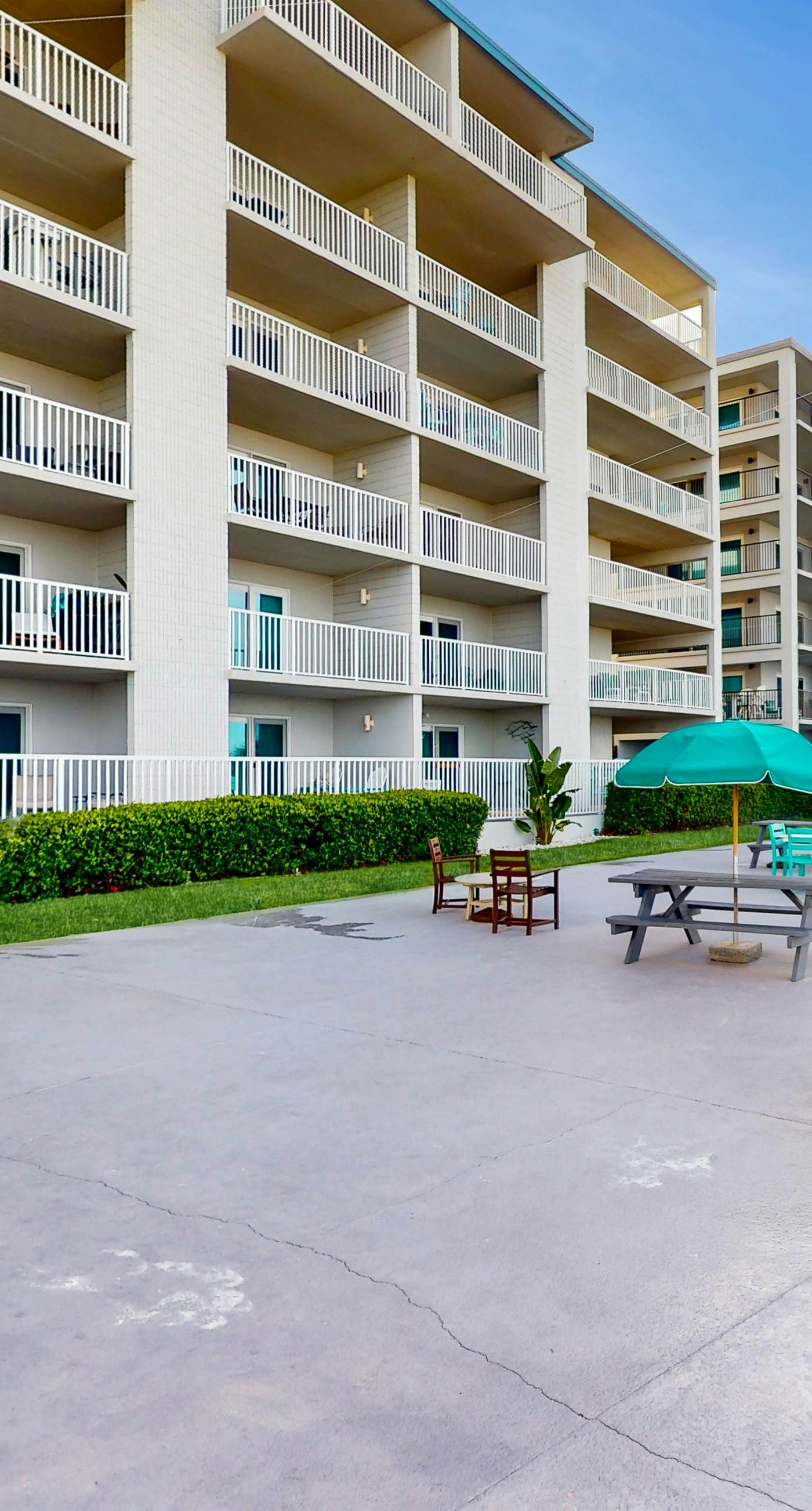 Oceanfront condo with shared pool, resort amenities, and private washer/dryer