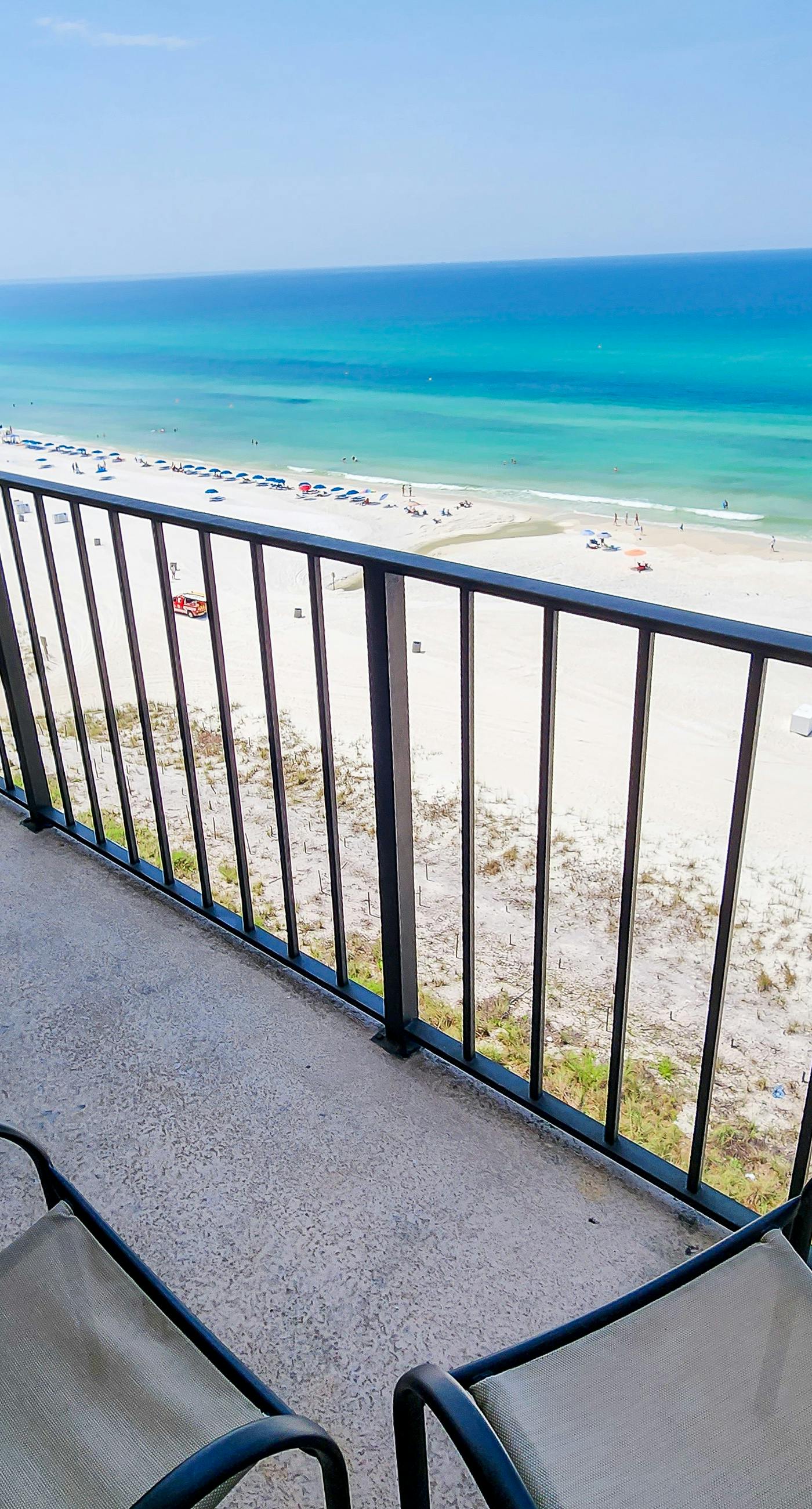 Exquisite beachfront condo with pool, hot tub, balcony, central AC, & W/D